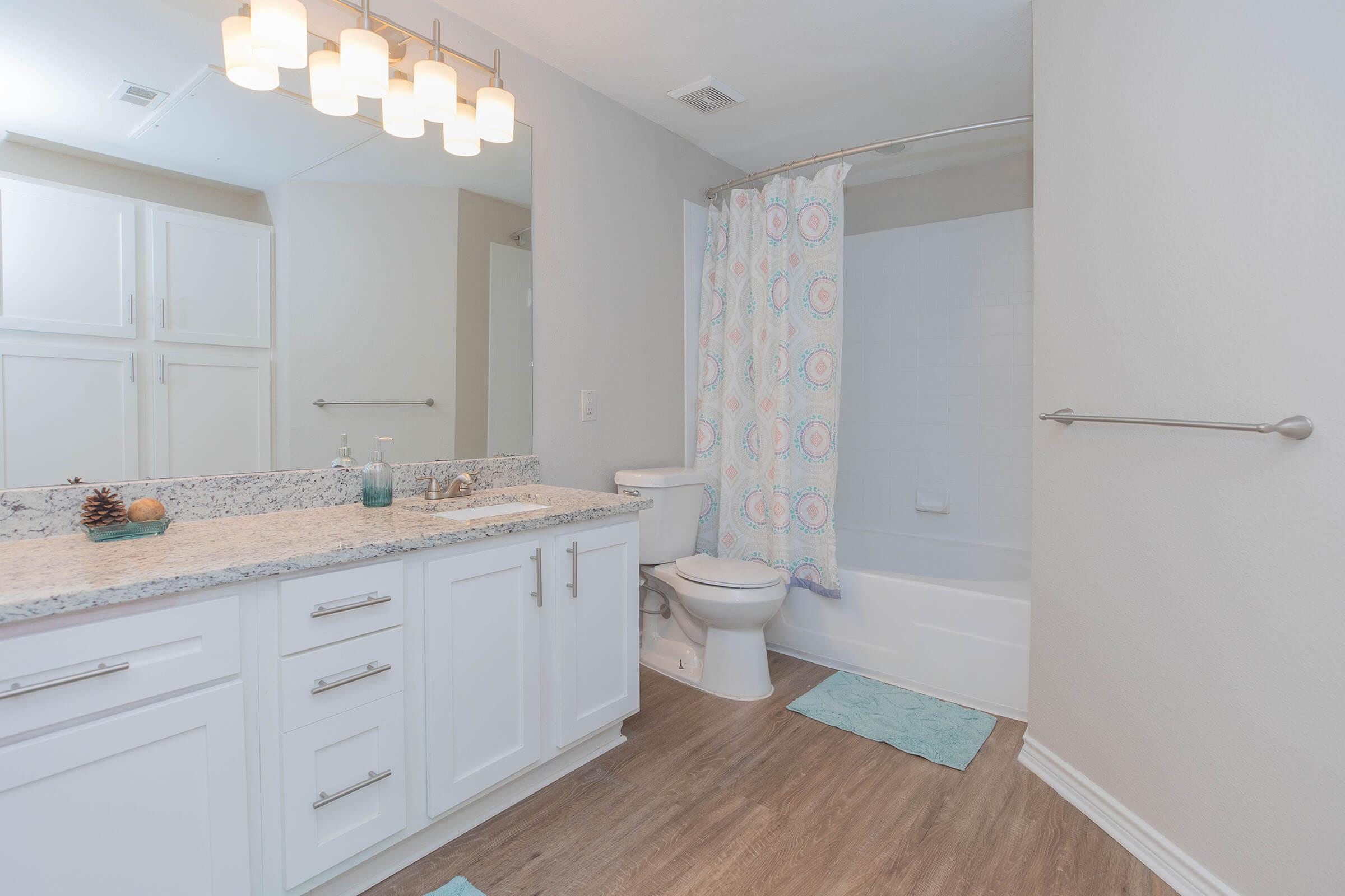 a kitchen with a sink and a mirror