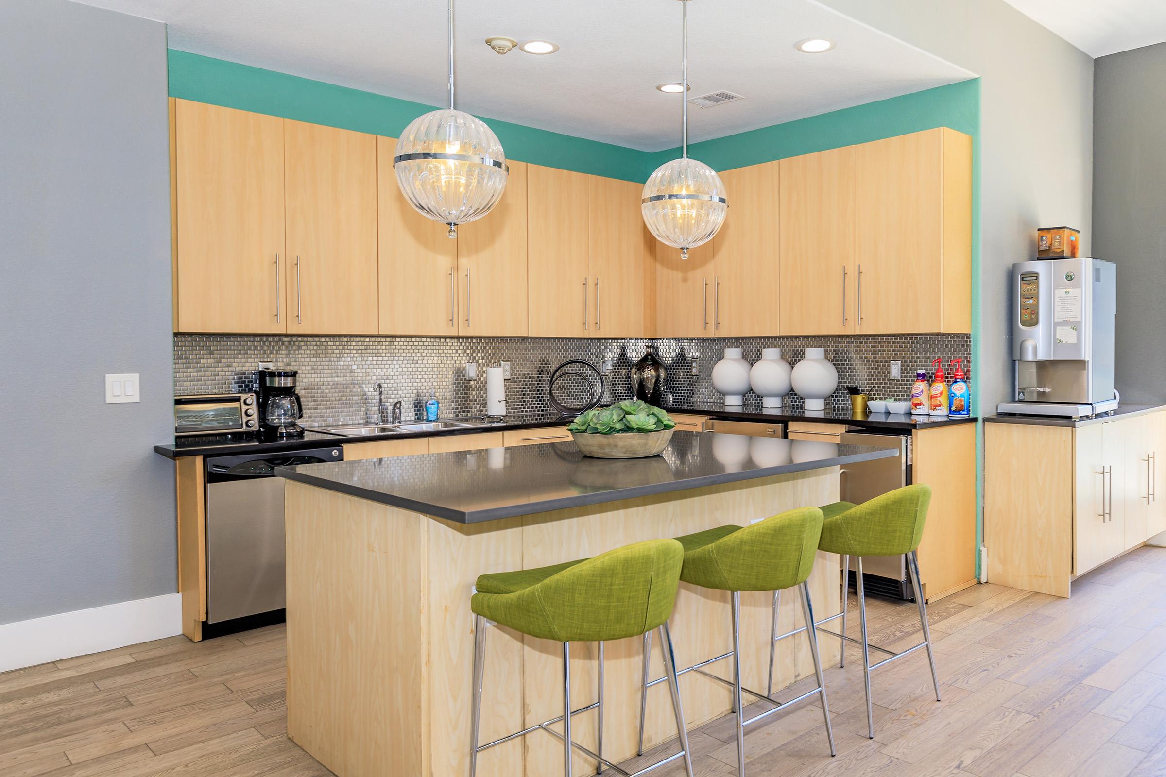 a kitchen with green walls