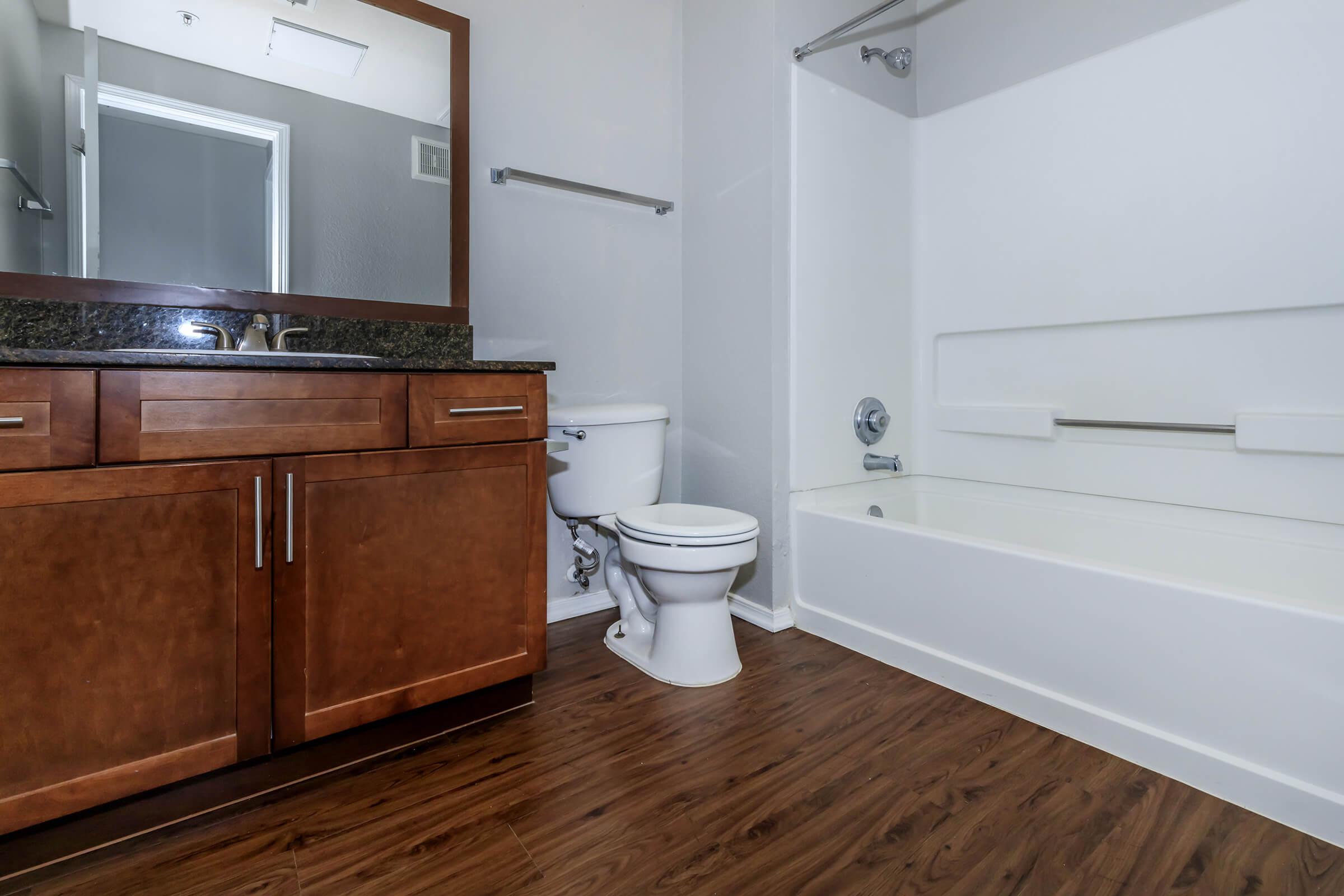 a kitchen with a sink and a mirror