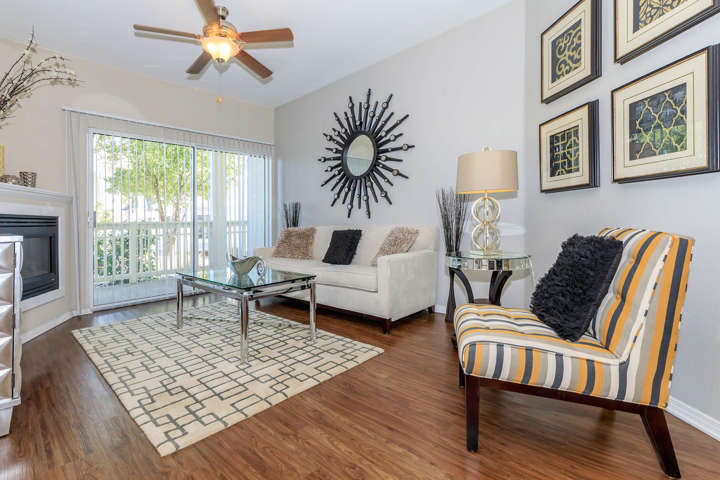 a living room filled with furniture and a fireplace