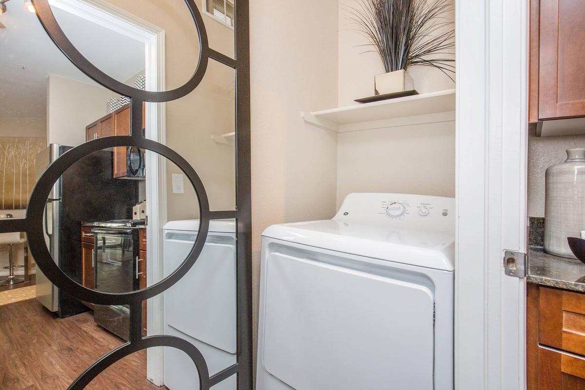 a kitchen with a sink and a mirror