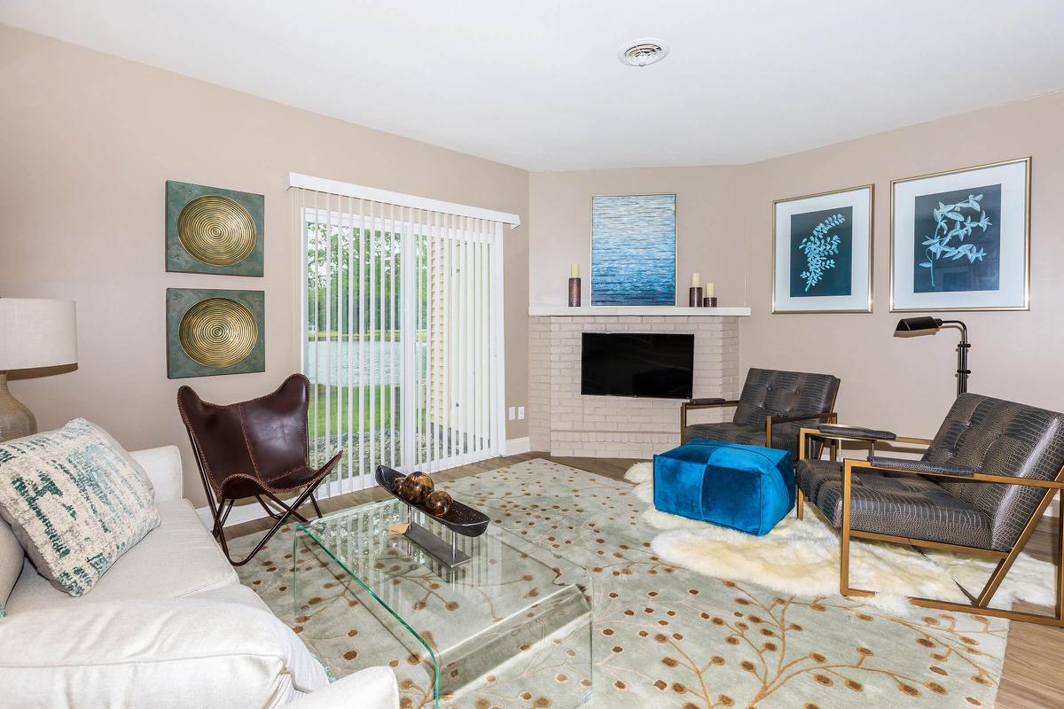 a living room filled with furniture and a tv