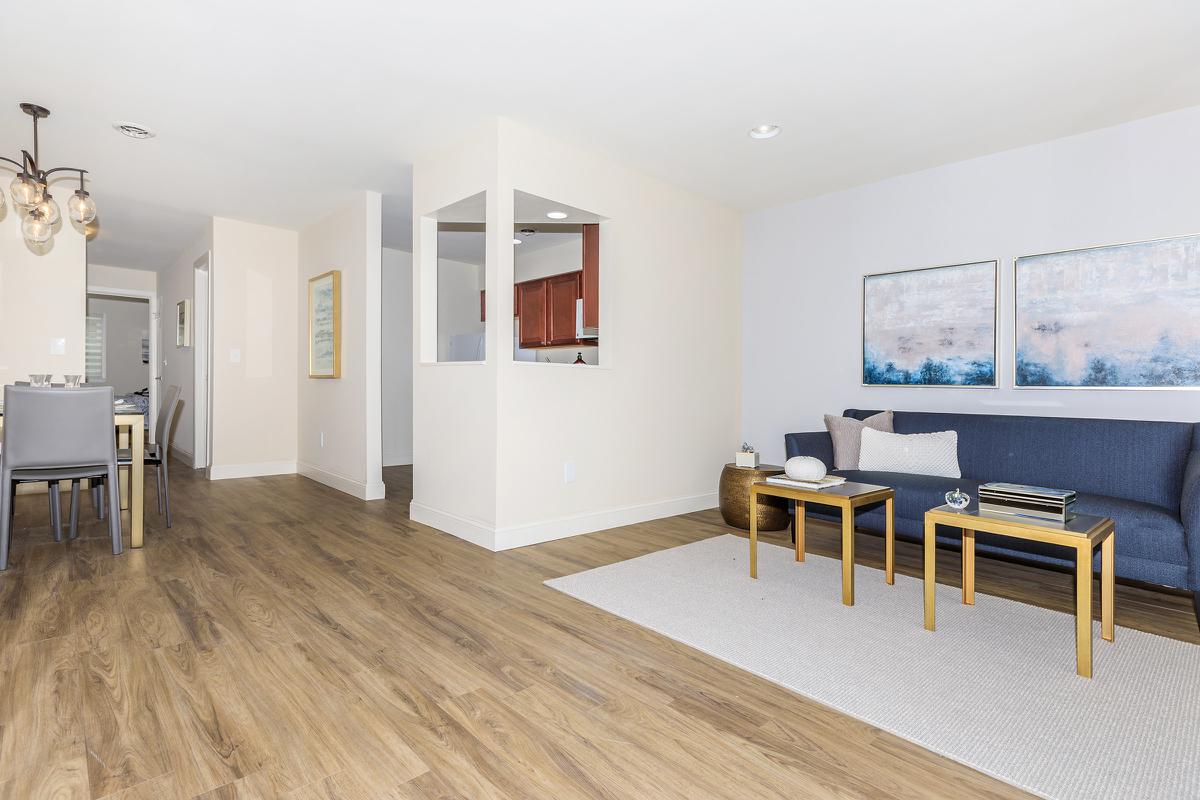 a living room with a wooden floor