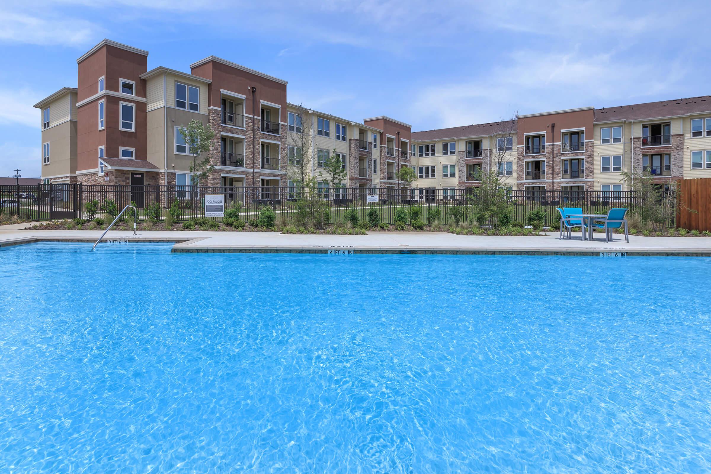 a pool next to a body of water