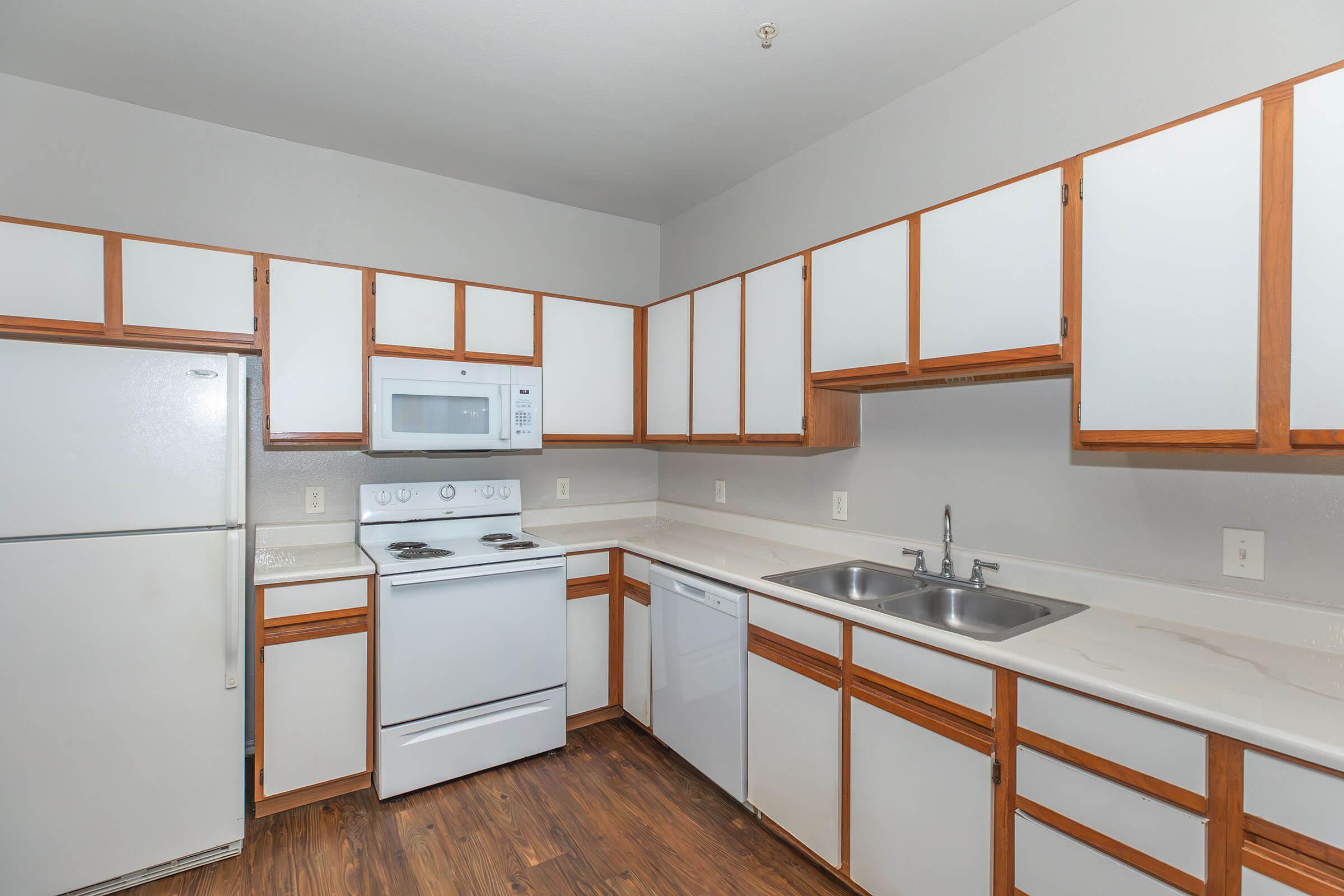 a kitchen with a stove and a sink