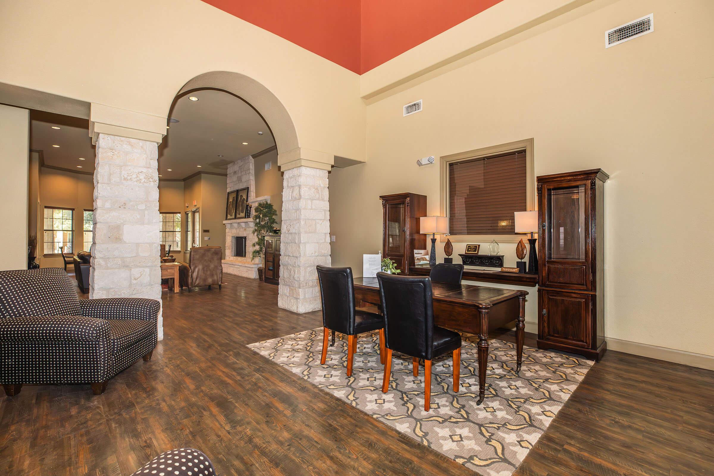 a living room filled with furniture and a fireplace