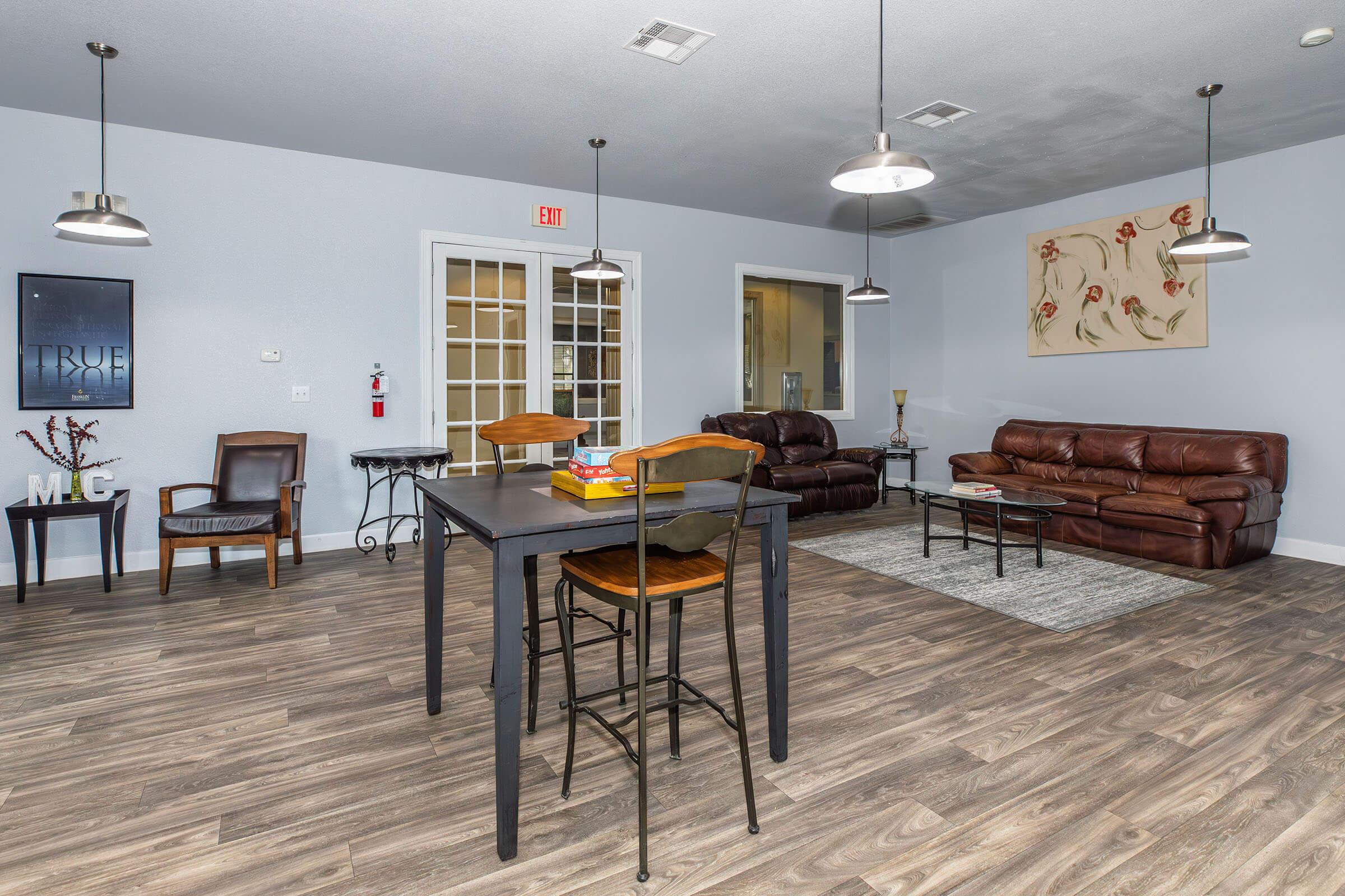 a living room filled with furniture and a table