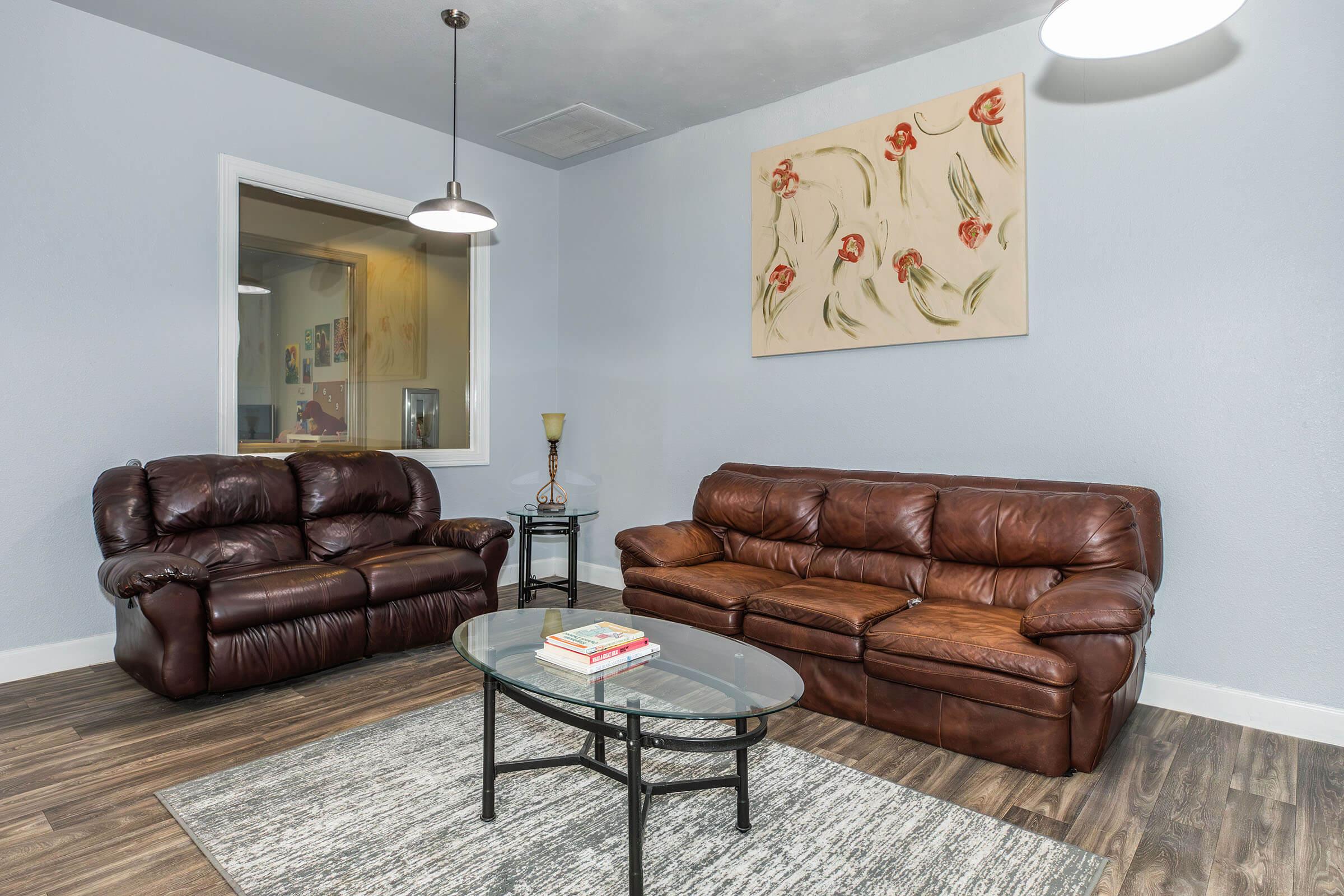 a brown leather couch in a living room