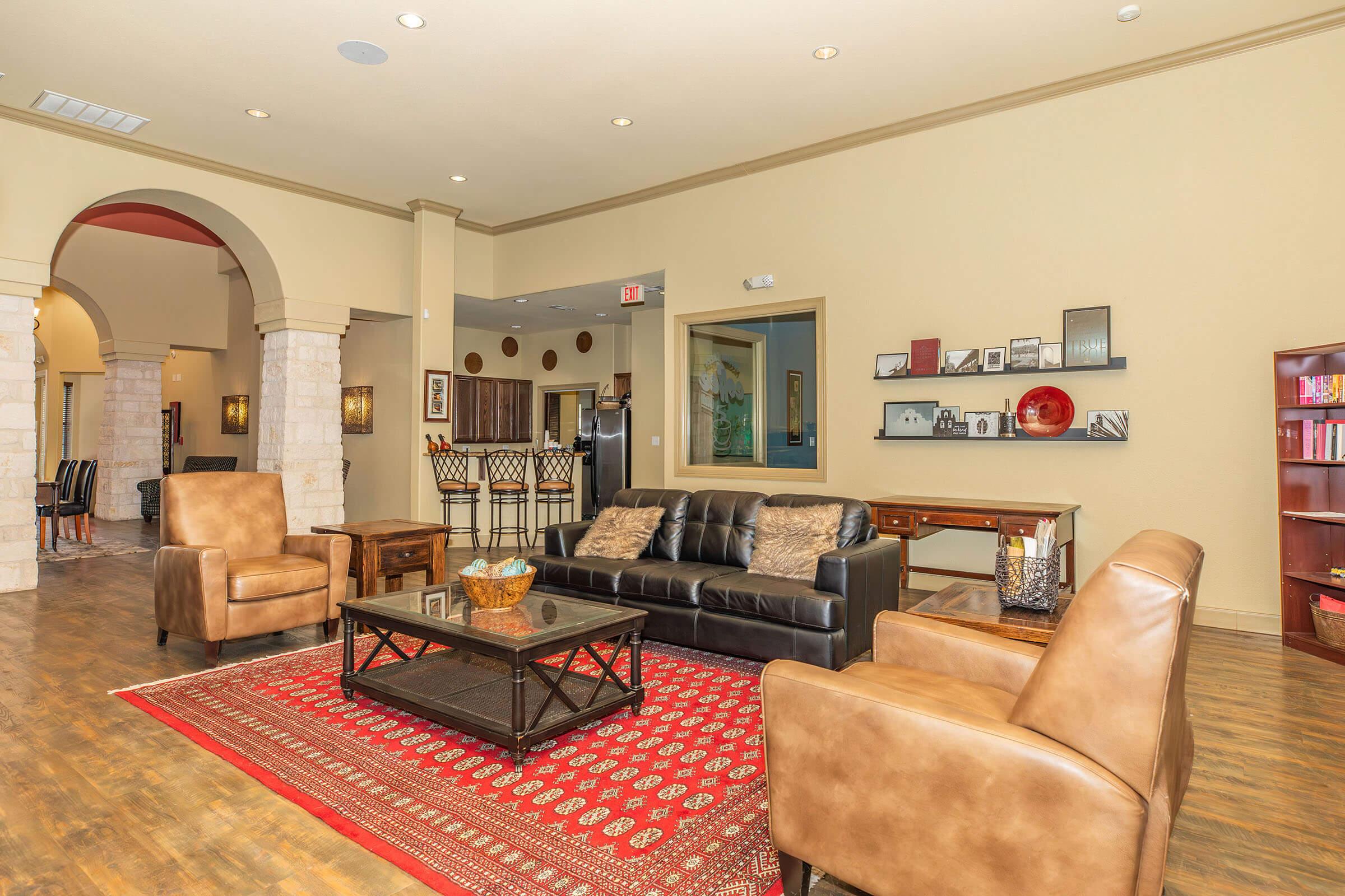 a living room filled with furniture and a fireplace