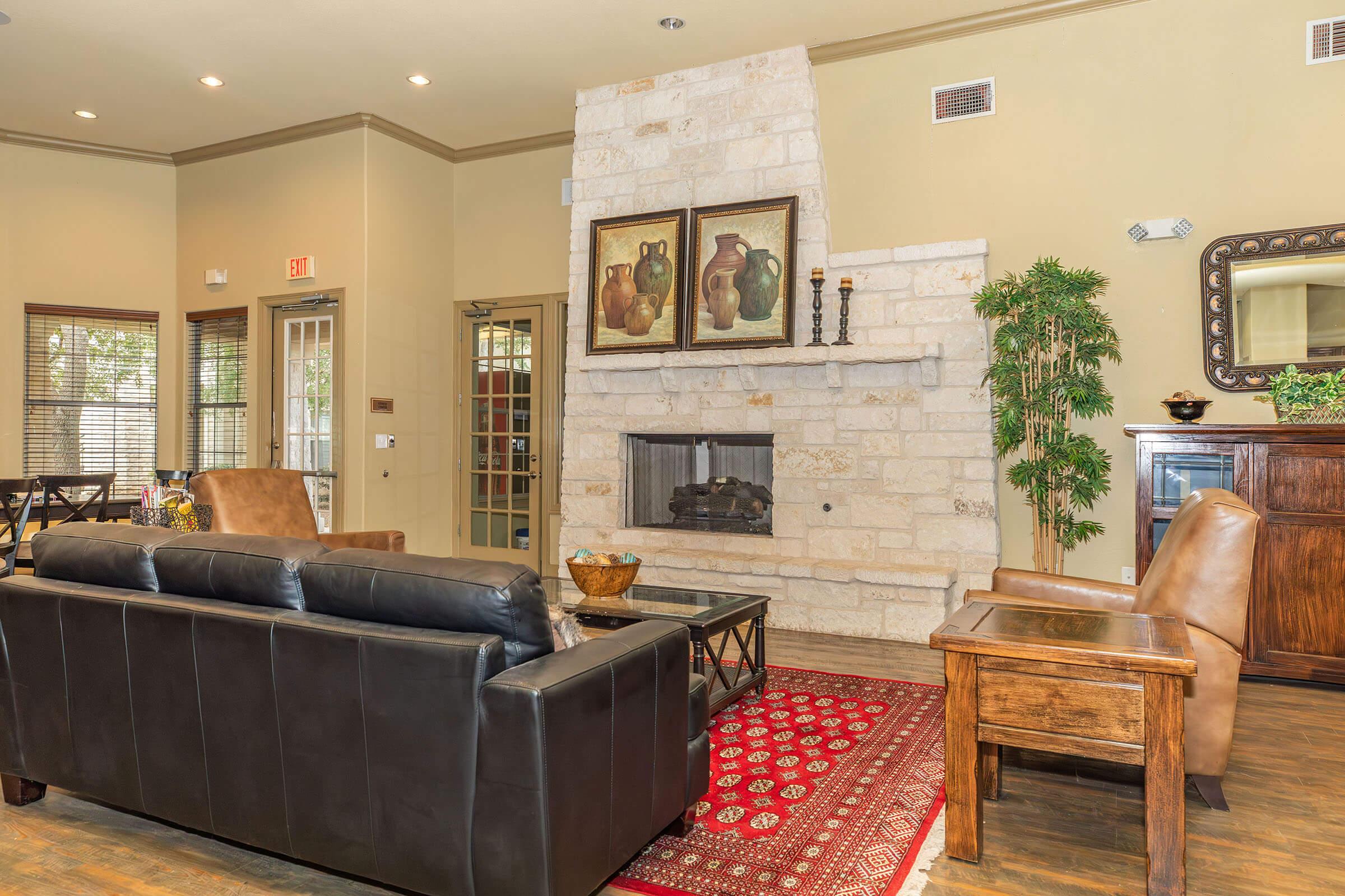 a living room filled with furniture and a fire place