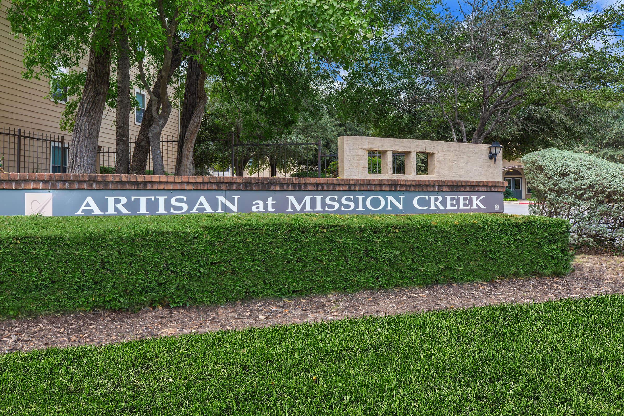 a sign in front of a tree