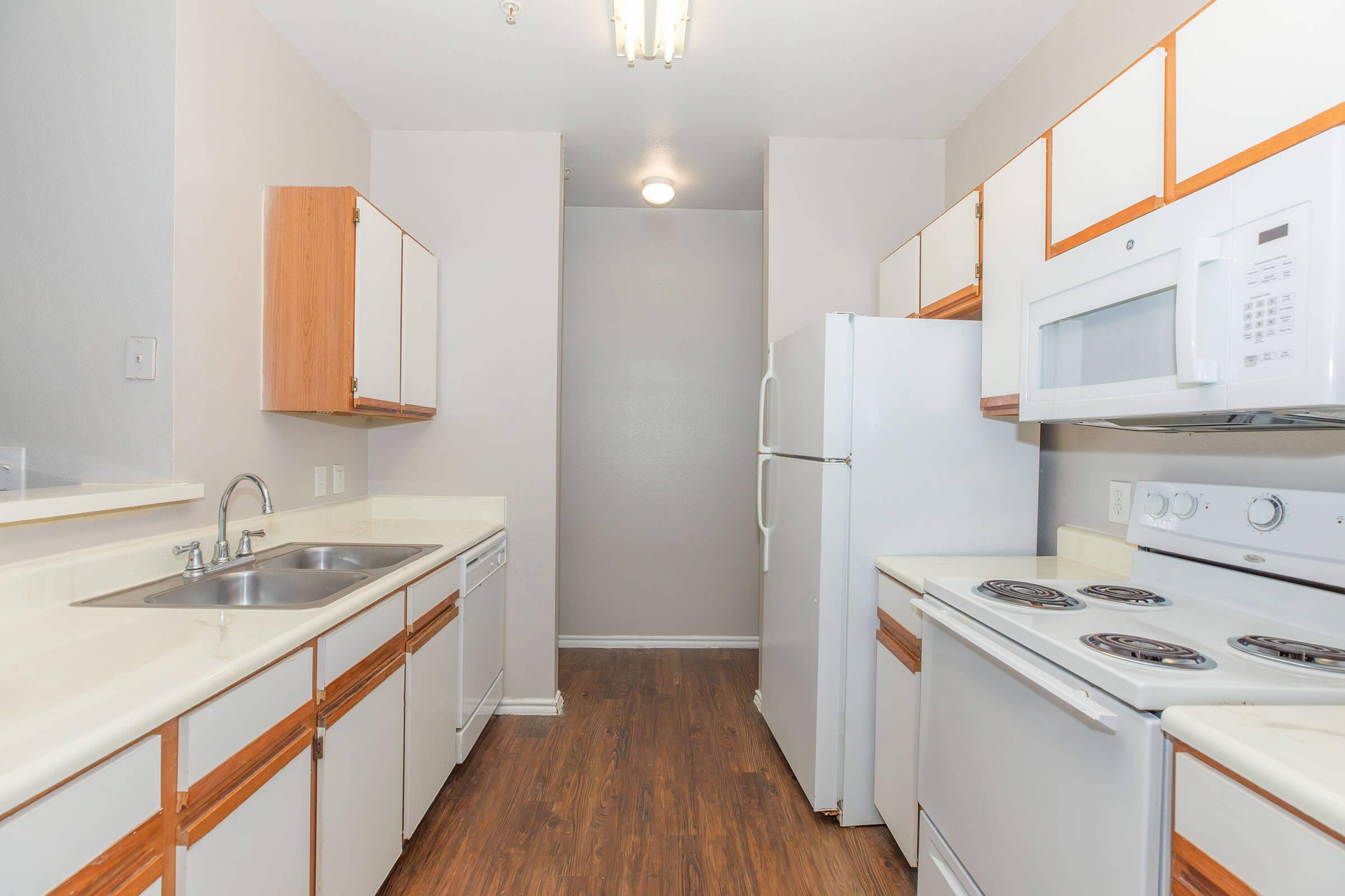 a kitchen with a stove and a sink