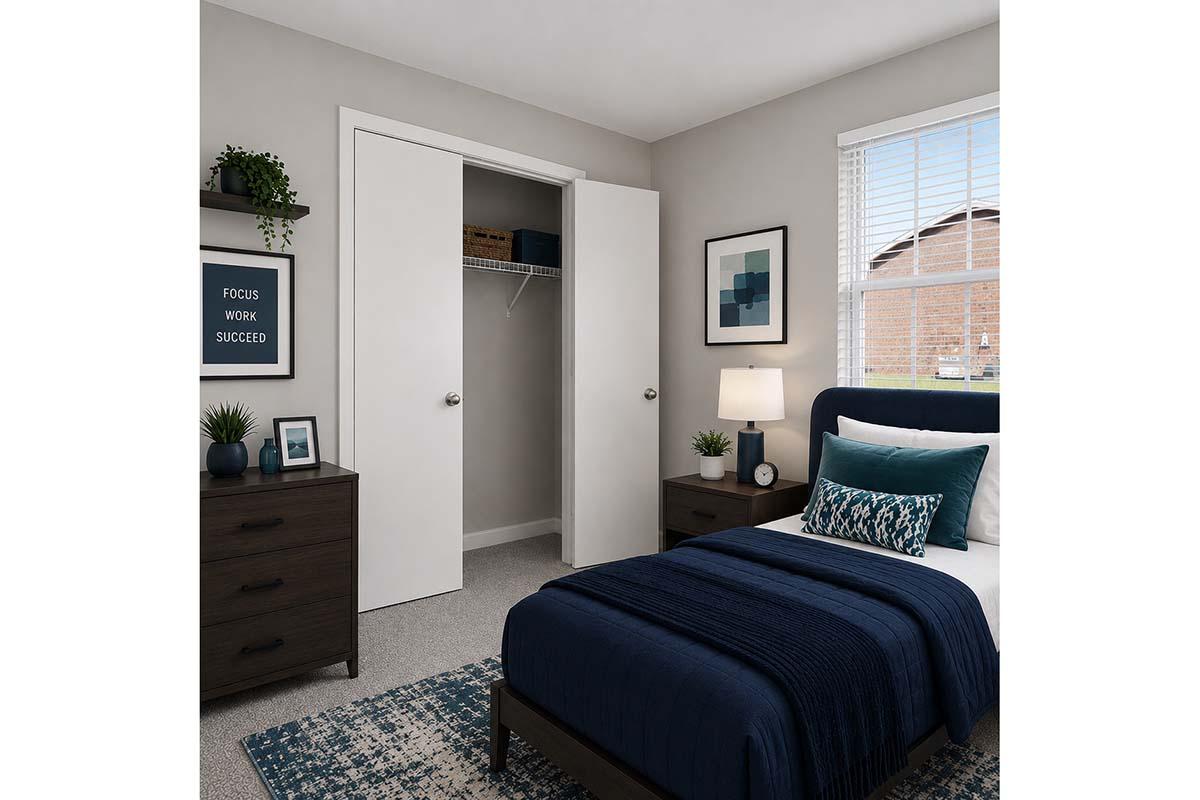 A modern bedroom featuring a single bed with navy blue bedding, a nightstand with a lamp, and a dark wood dresser. There is a framed picture on the wall, a houseplant on the dresser, and a motivational poster that reads "FOCUS WORK SUCCEED." A closet with double doors is visible, and a window offers natural light.