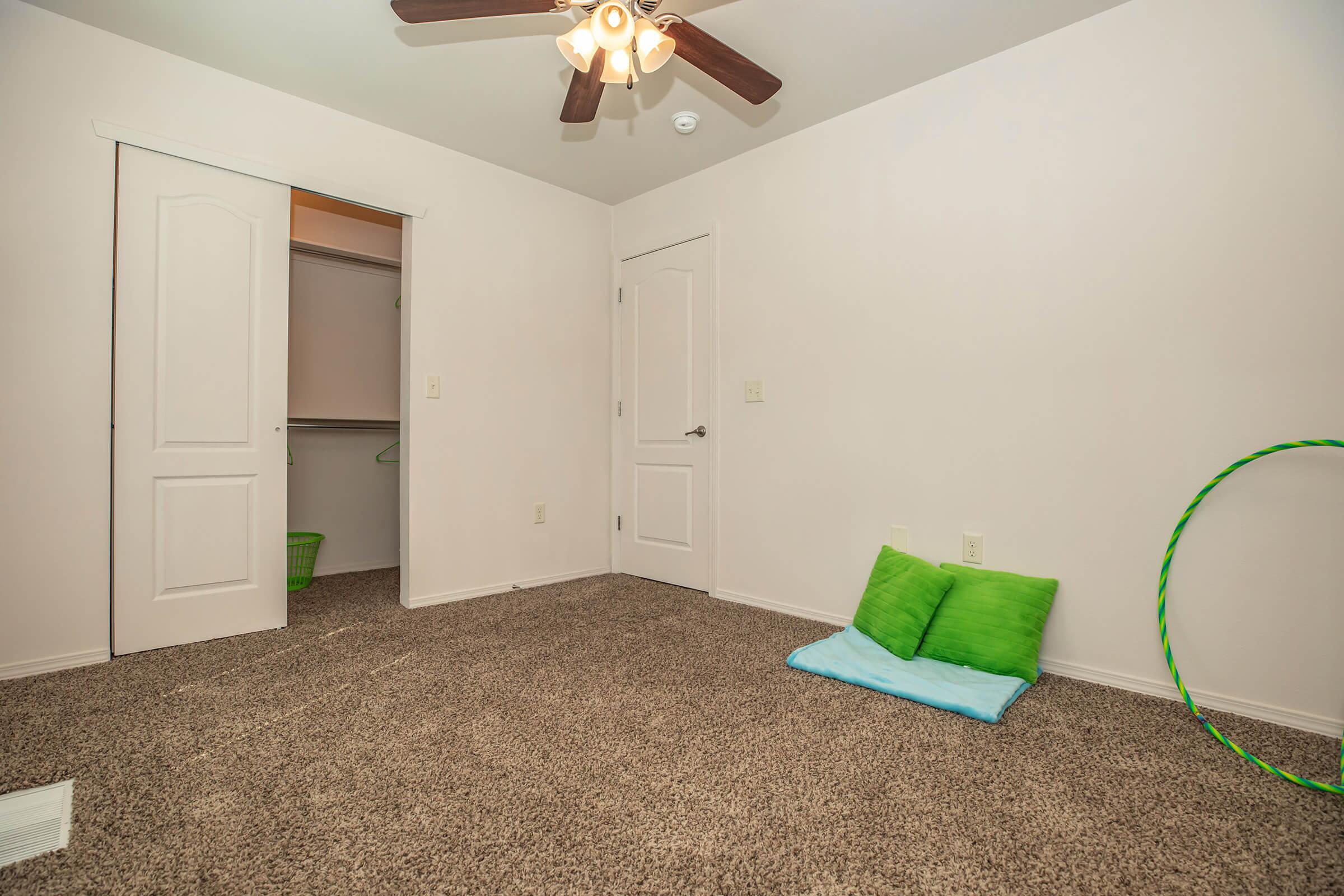 a bedroom with a bed and a mirror