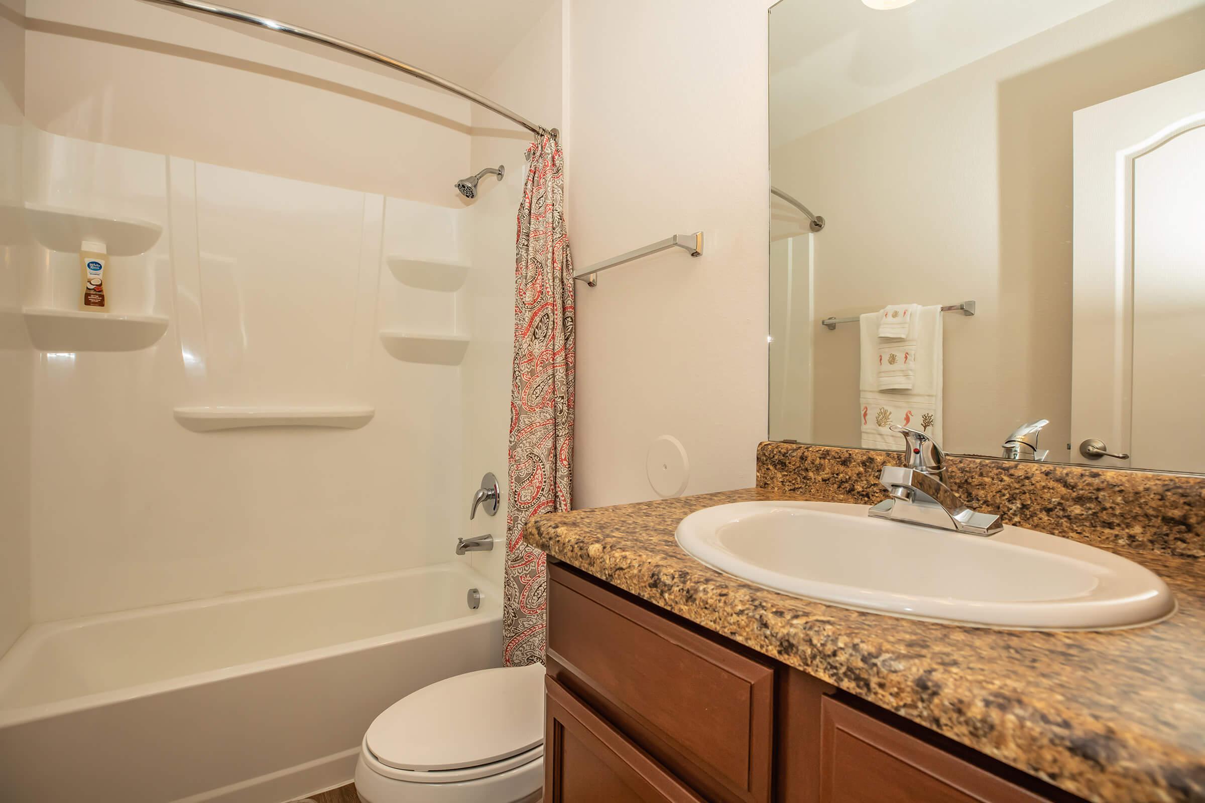 a room with a sink and a mirror