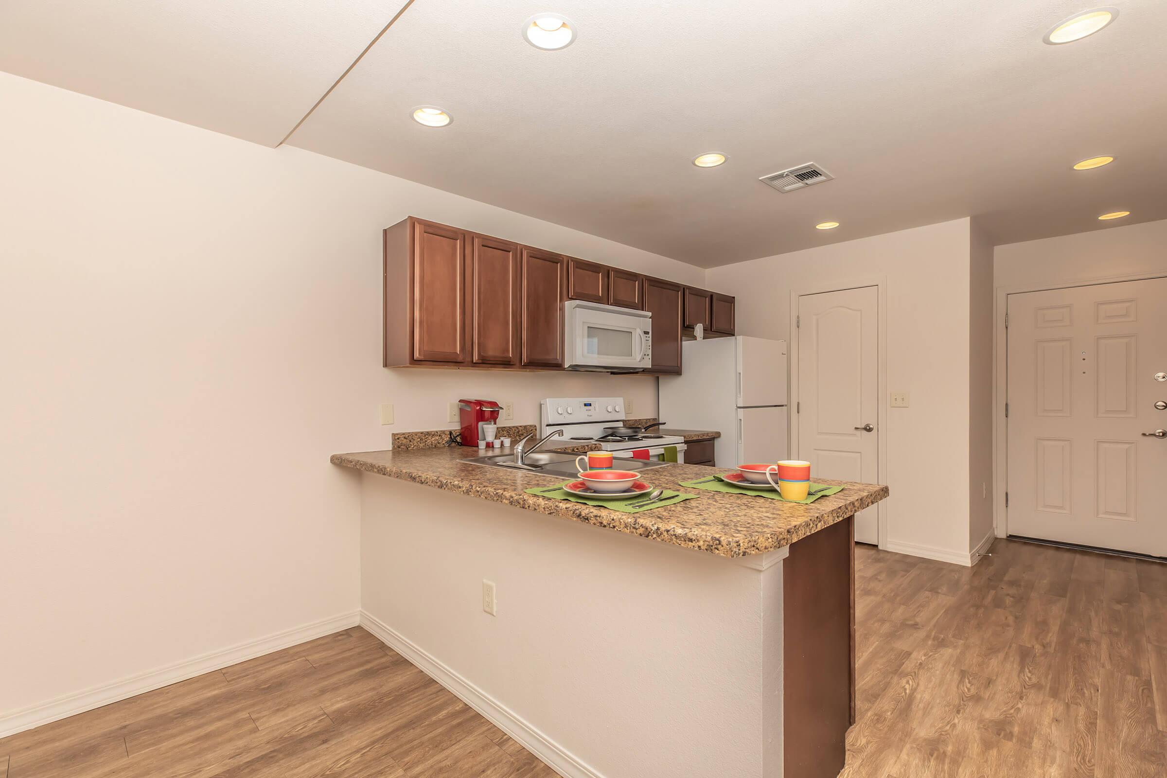 a kitchen with a table in a room