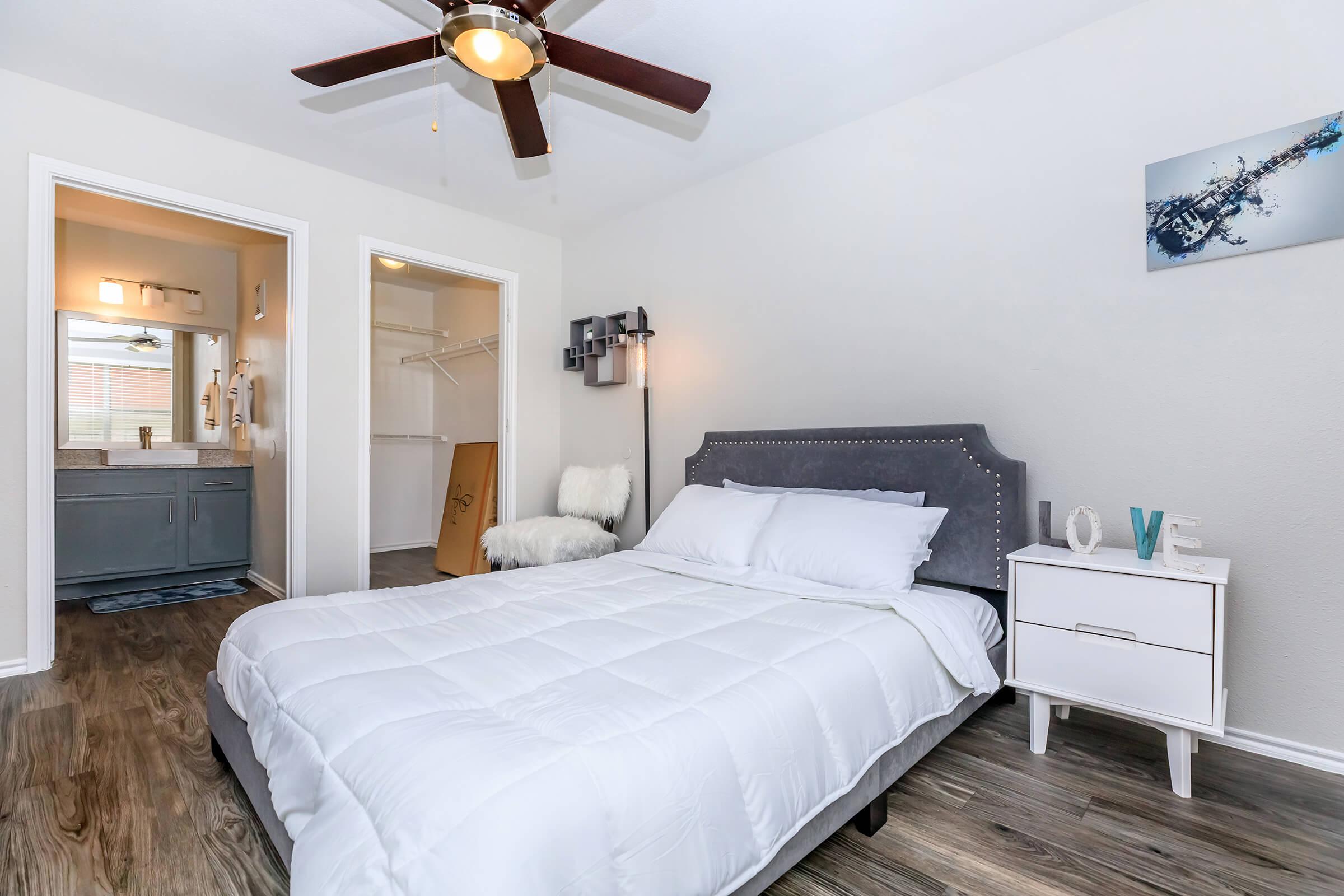 a bedroom with a large bed in a room