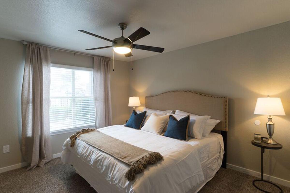 a bedroom with a large bed in a hotel room