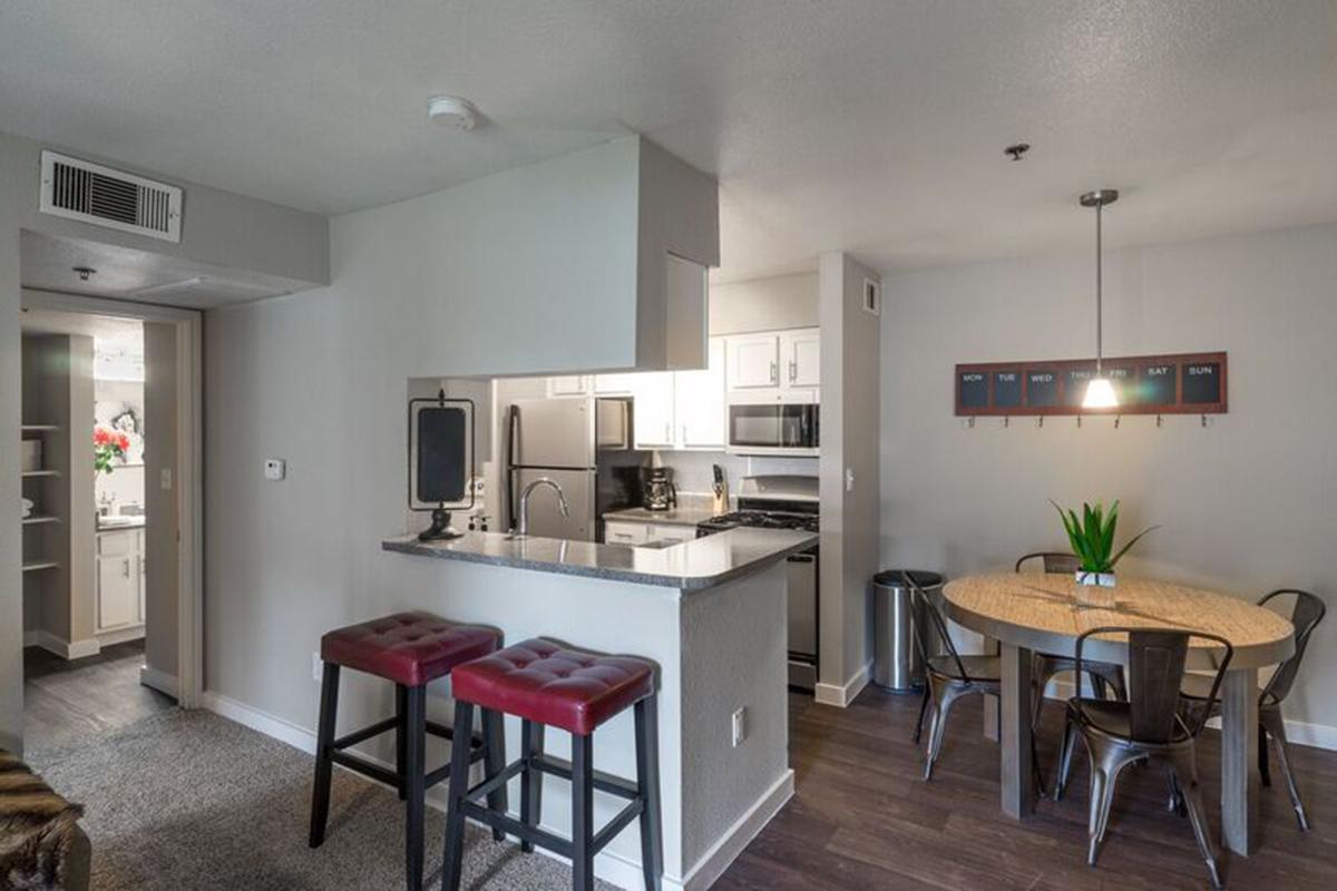 a kitchen with a dining room table