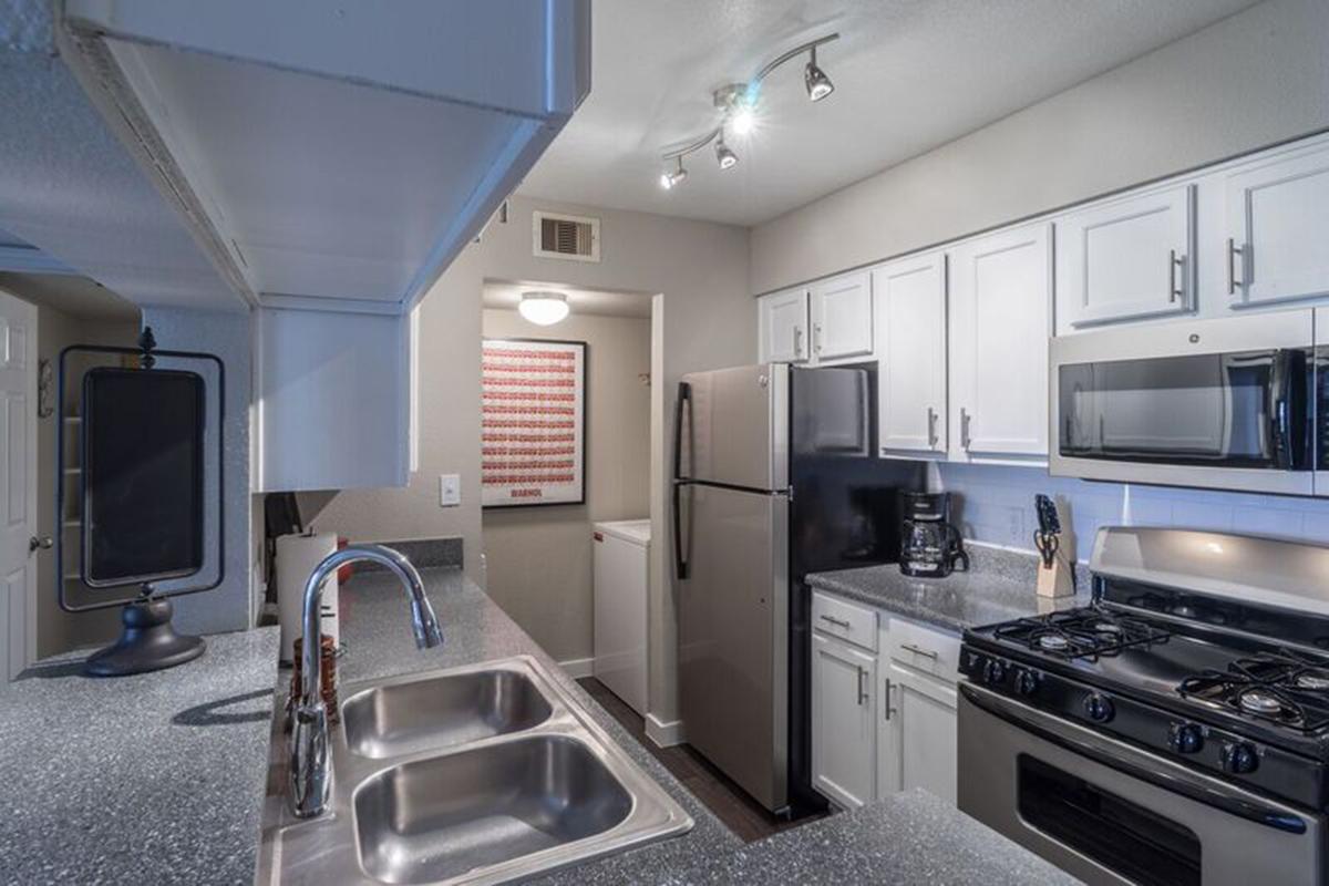 a modern kitchen with stainless steel appliances