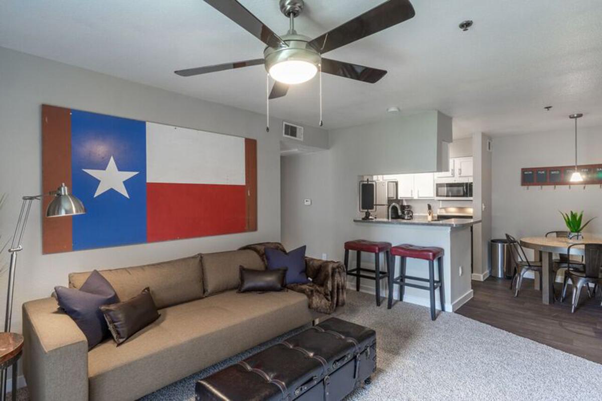 a living room filled with furniture and a table