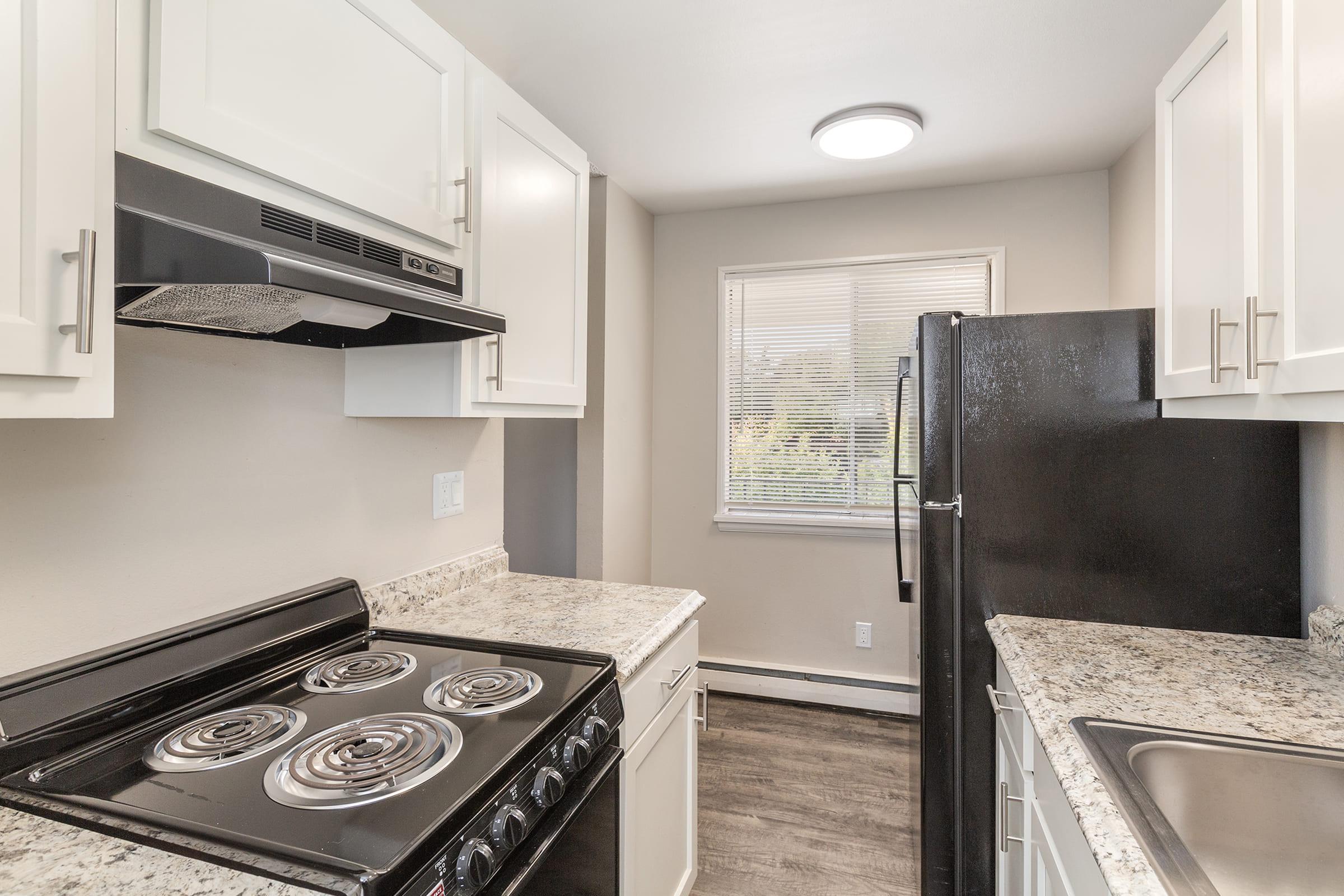 a kitchen with a sink and a window