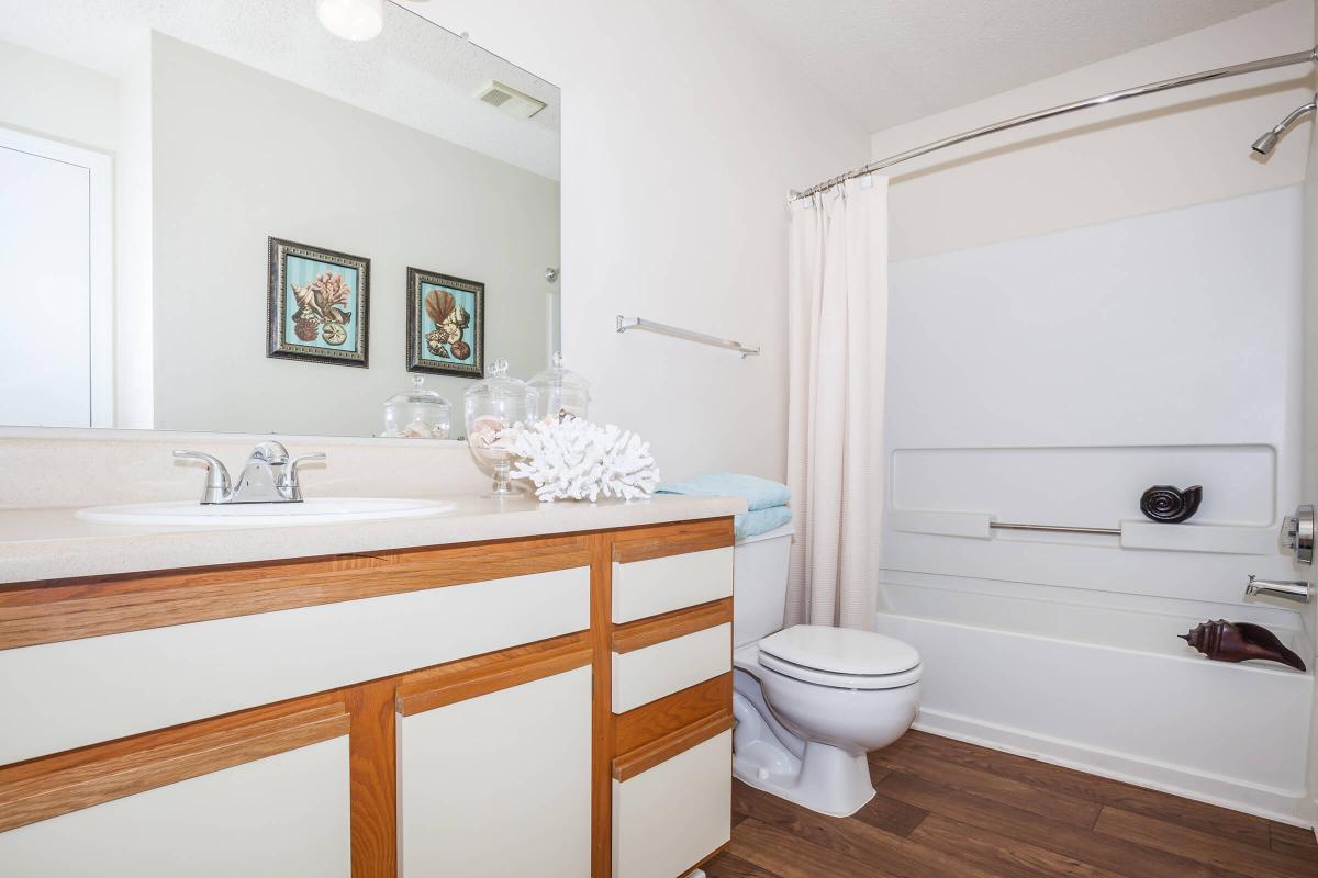 a room with a sink and a mirror