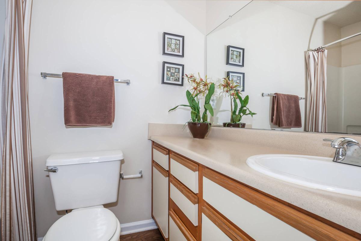 a white tub sitting next to a sink
