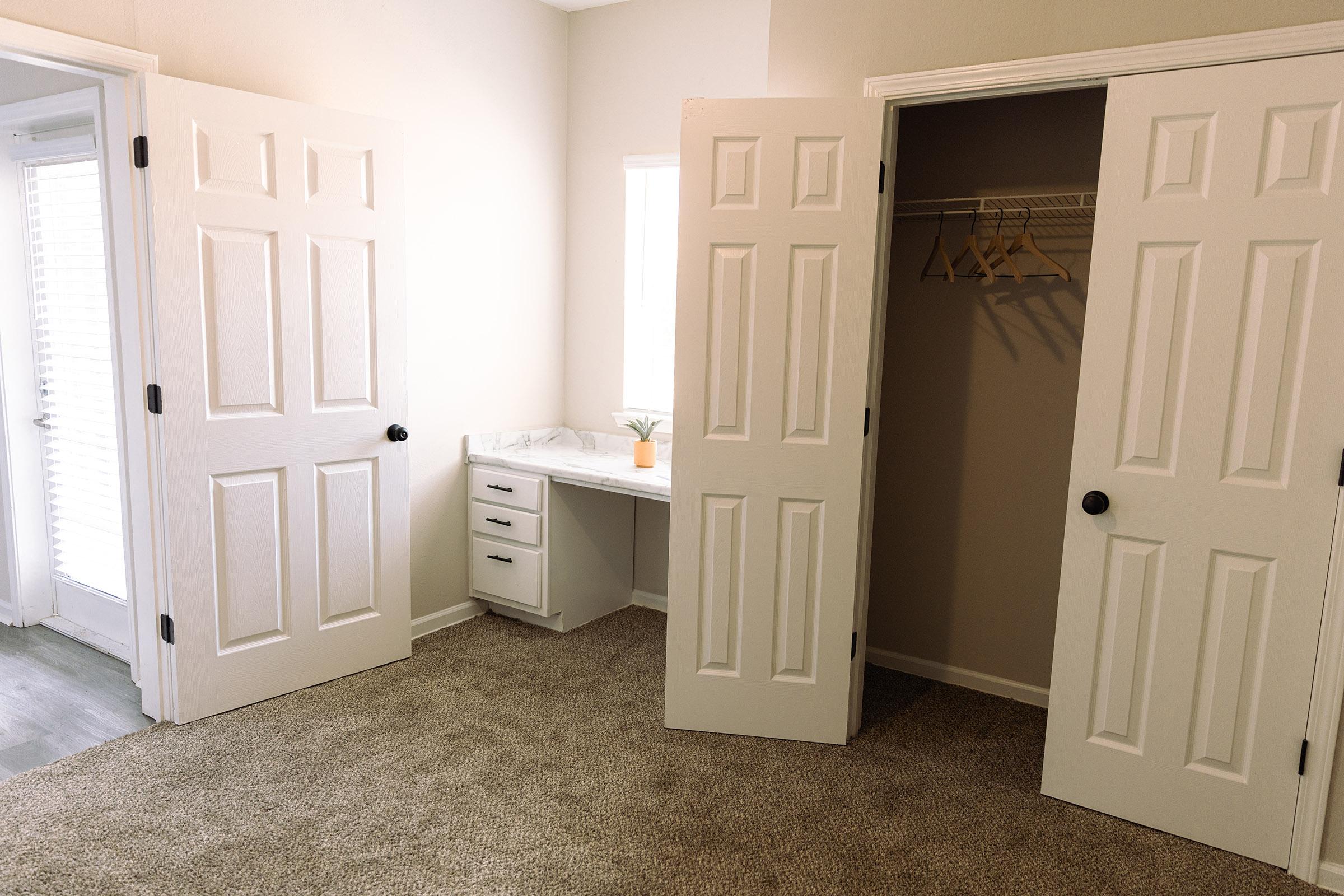 a view of a bedroom next to a door