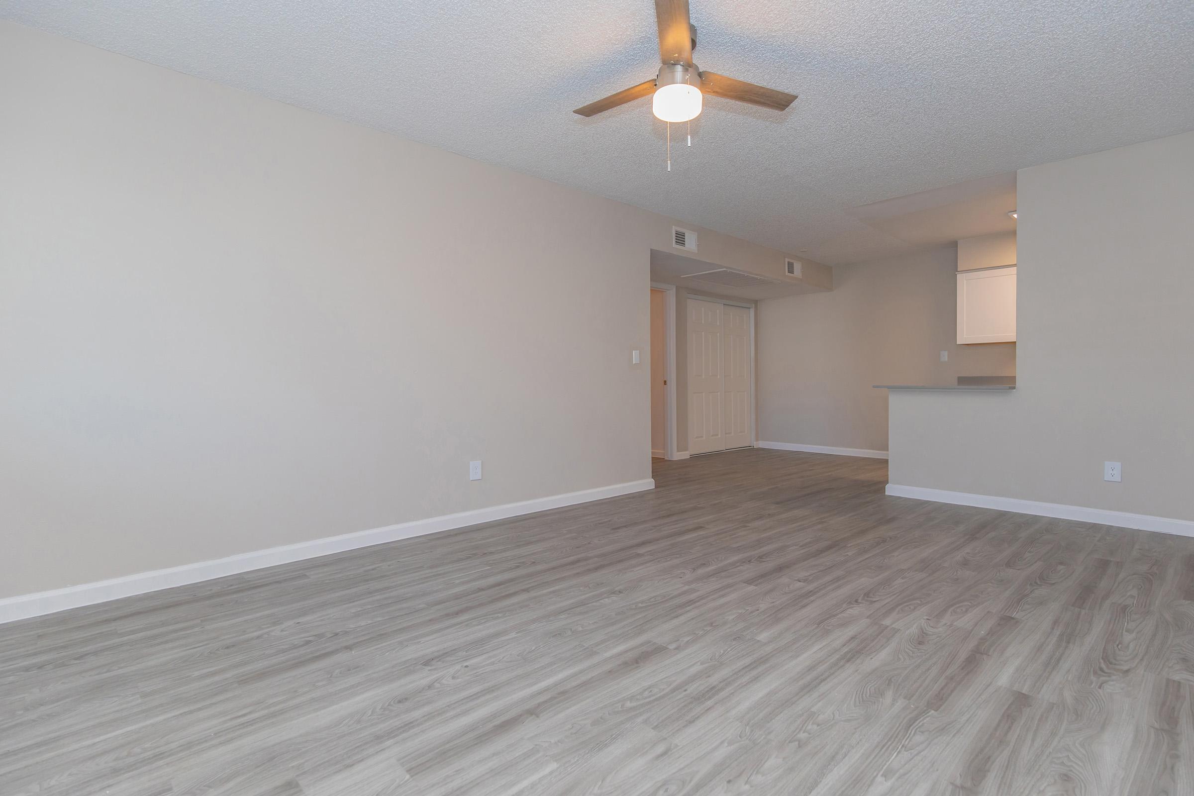 a large empty room with a wooden floor