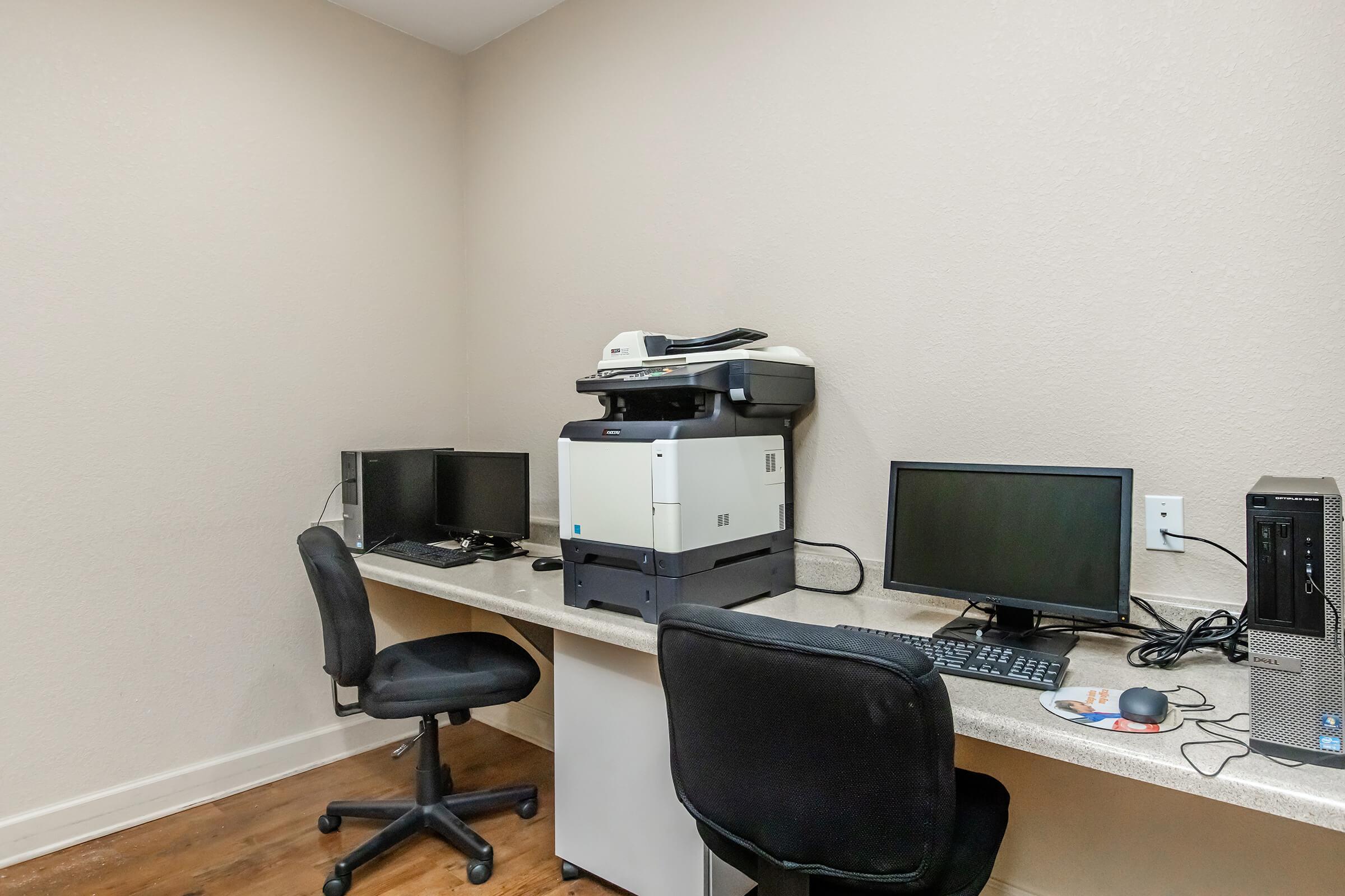 a desktop computer sitting on top of a chair