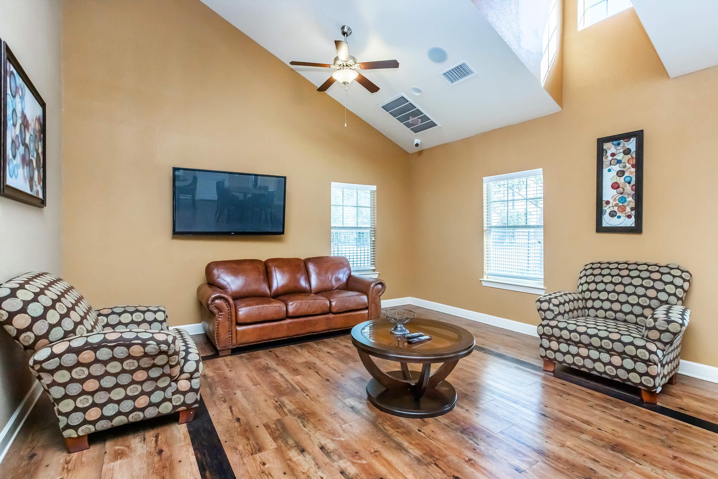 a living room filled with furniture and a fire place