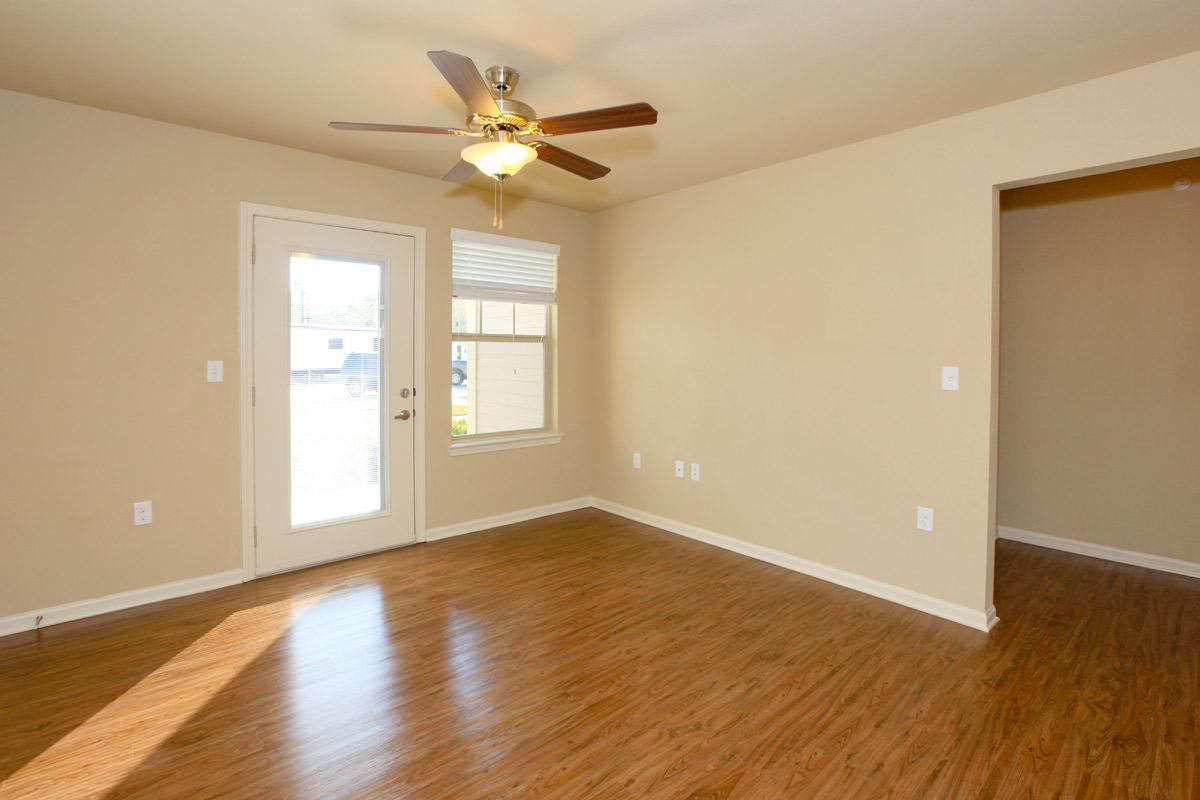 a large empty room with a hard wood floor