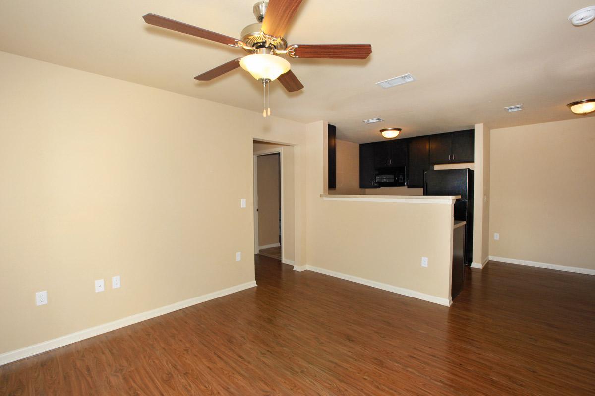 a large empty room with a wood floor