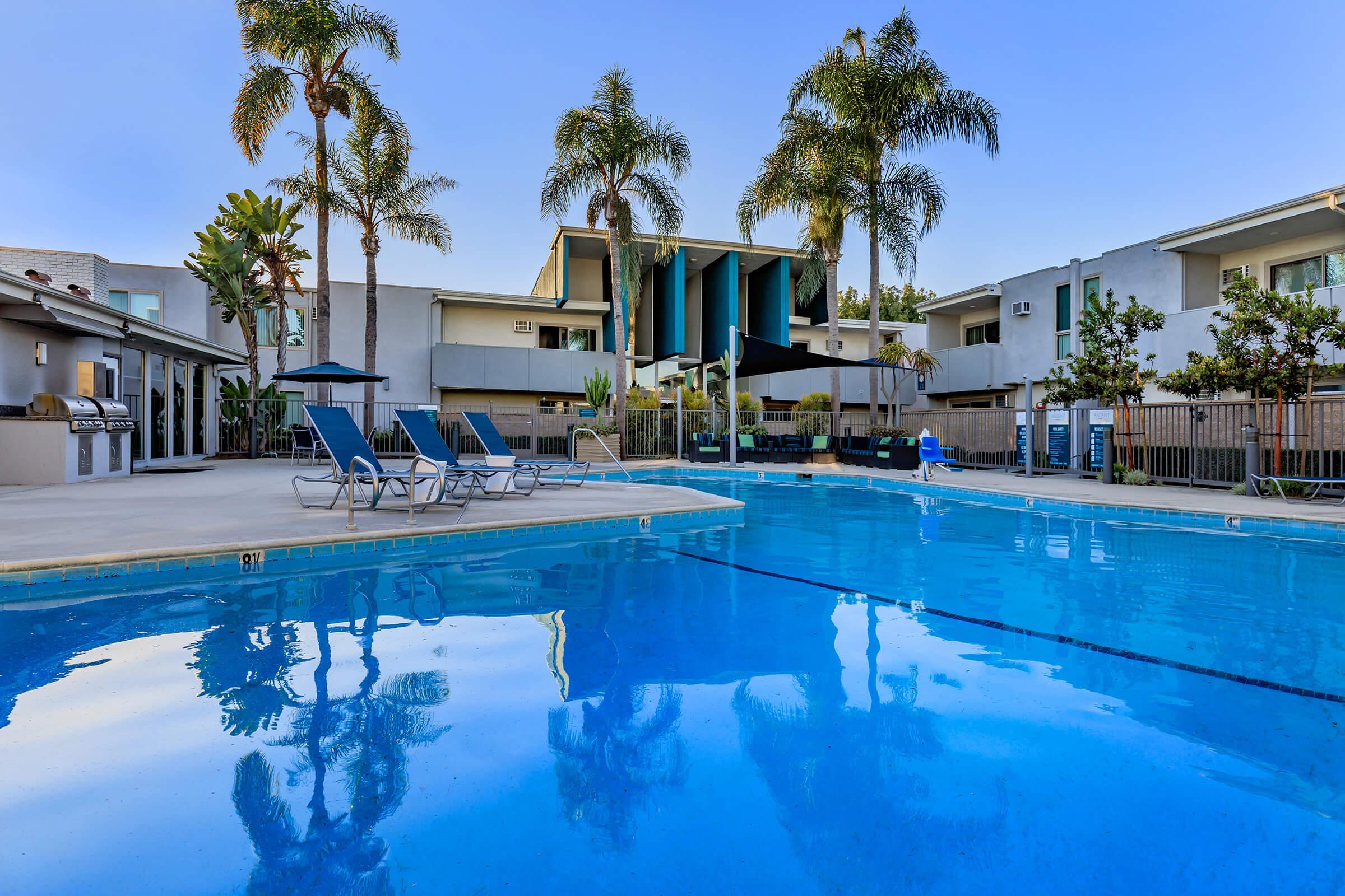 a large pool of water in front of a house