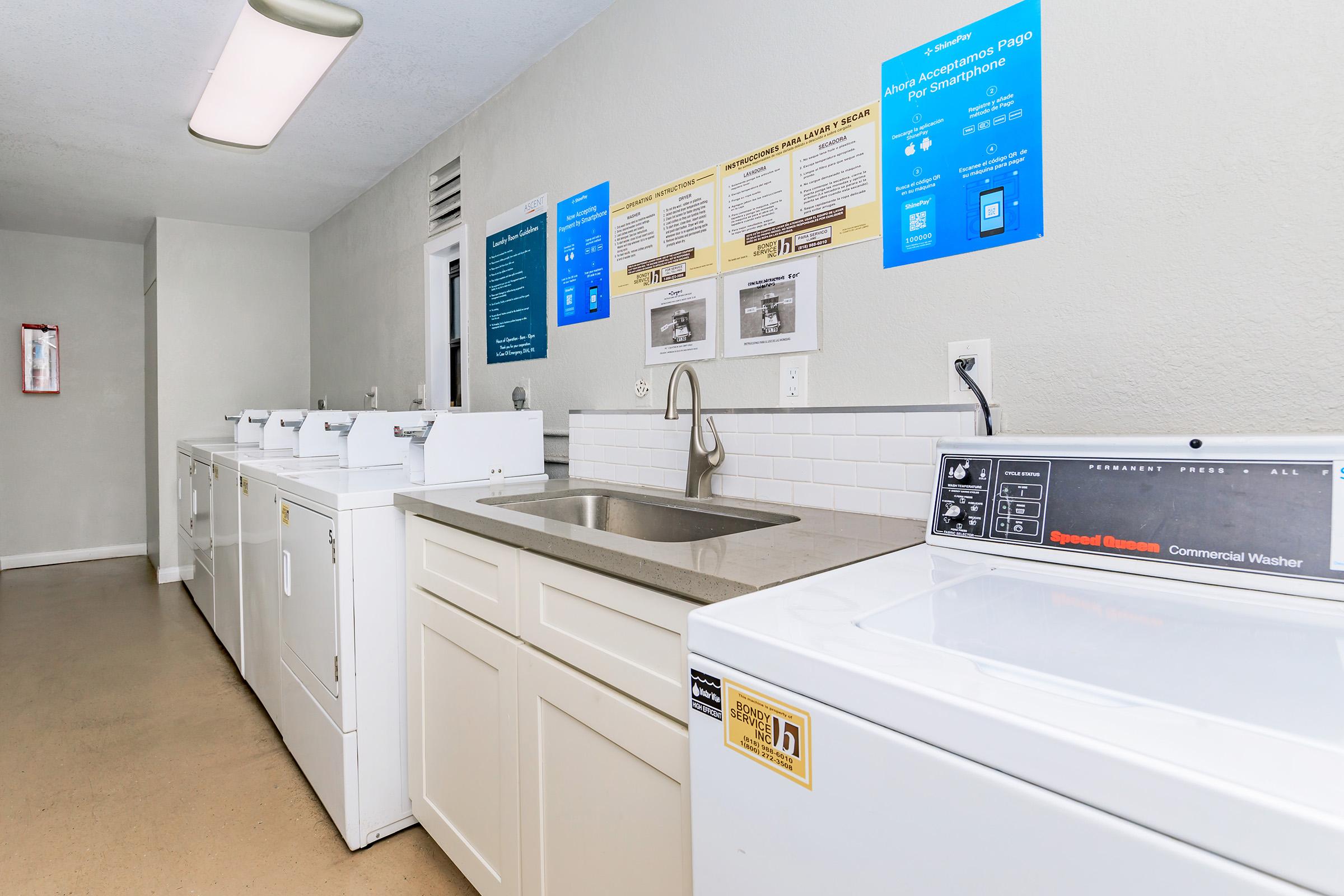 a kitchen with a sink and a refrigerator