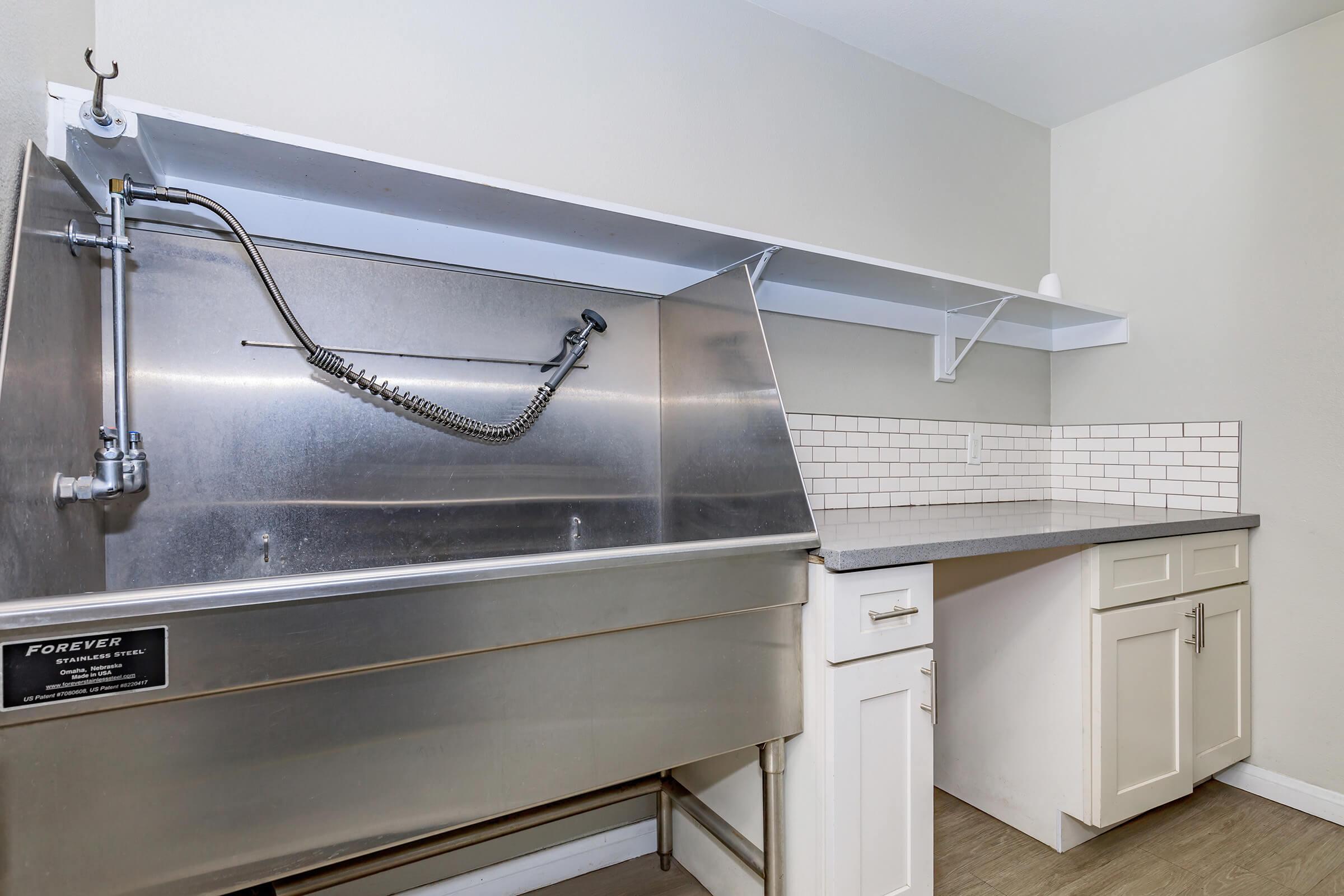 a stove top oven sitting inside of a kitchen