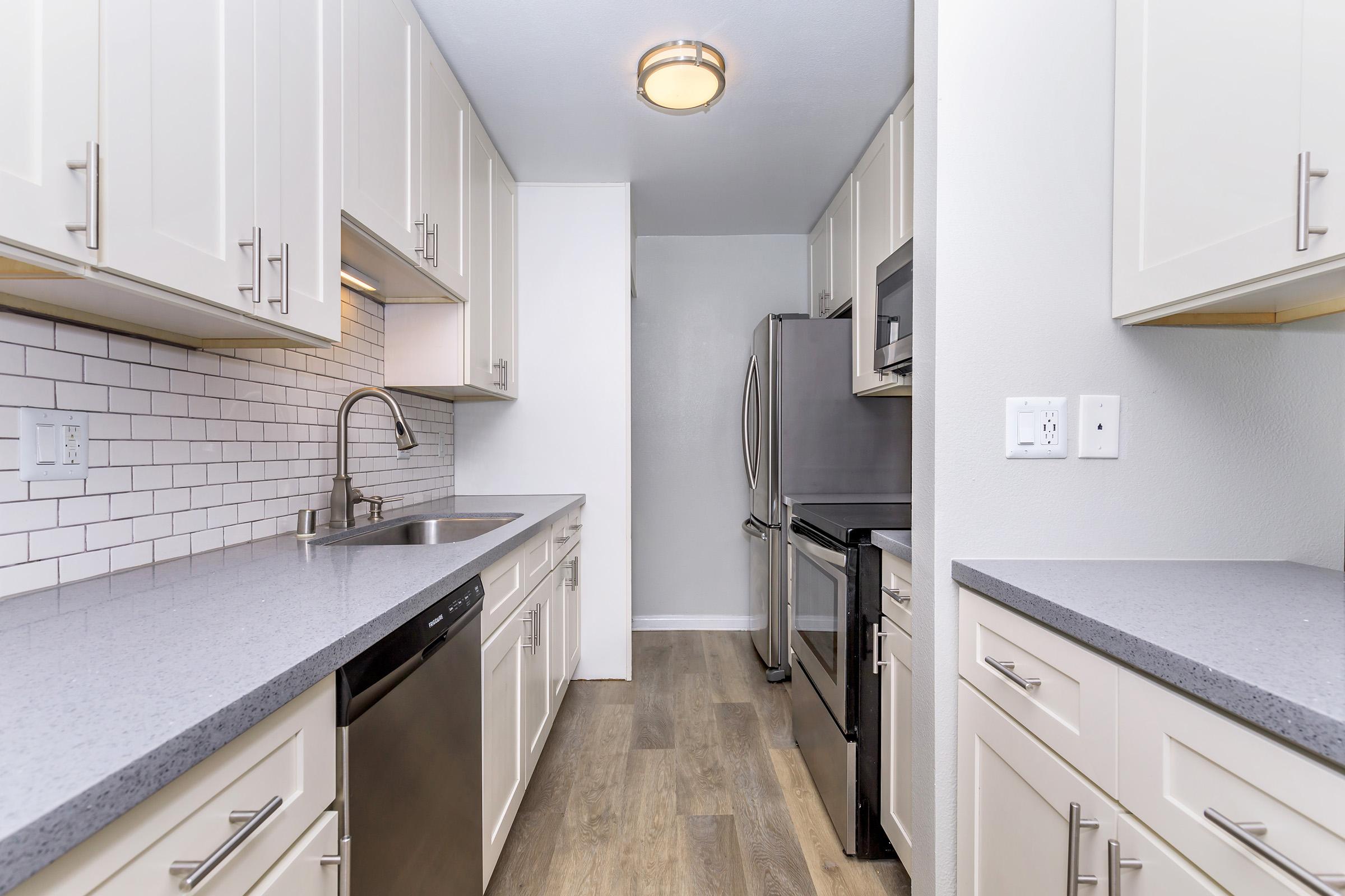 a kitchen with a tile floor