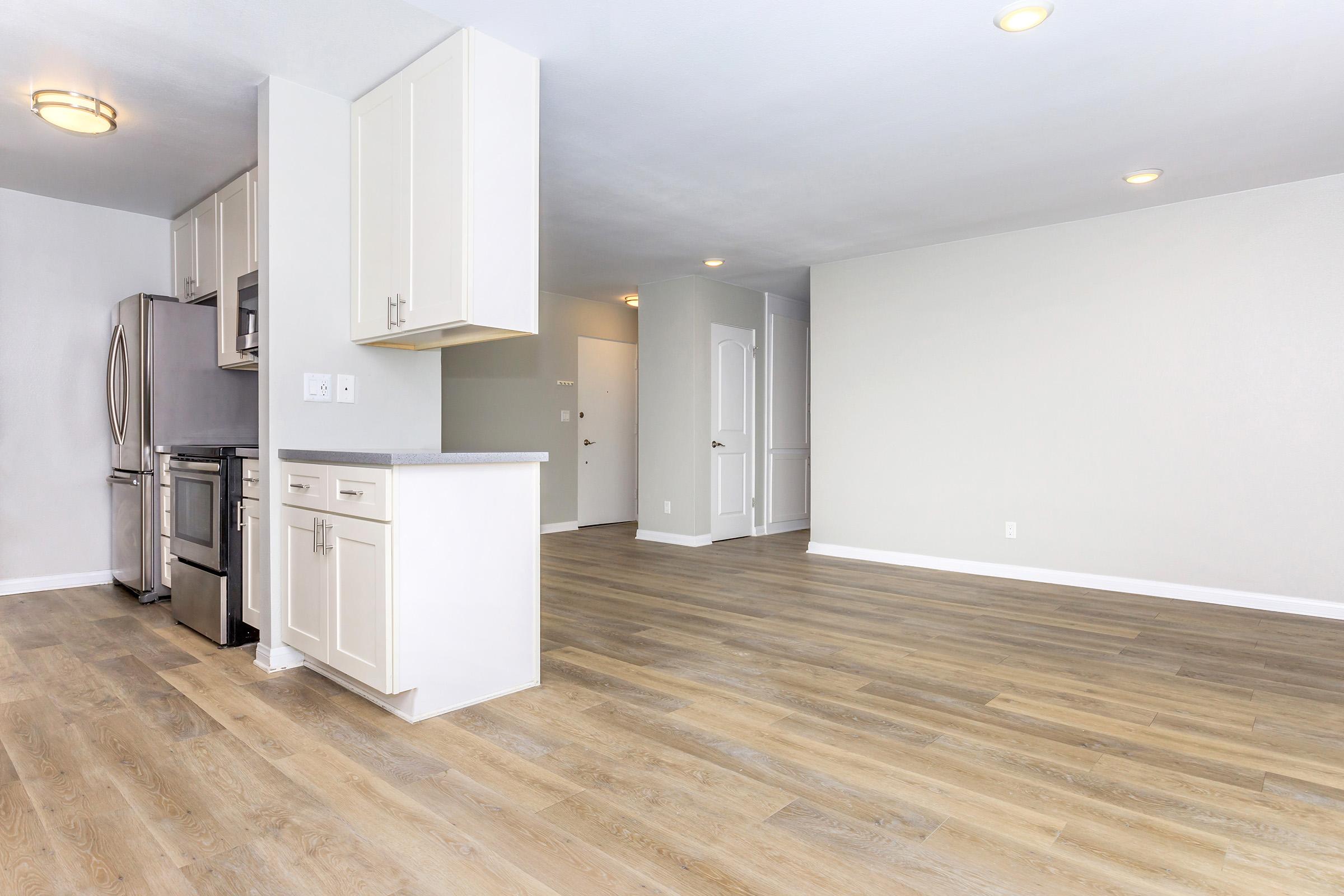 a kitchen with a wooden floor