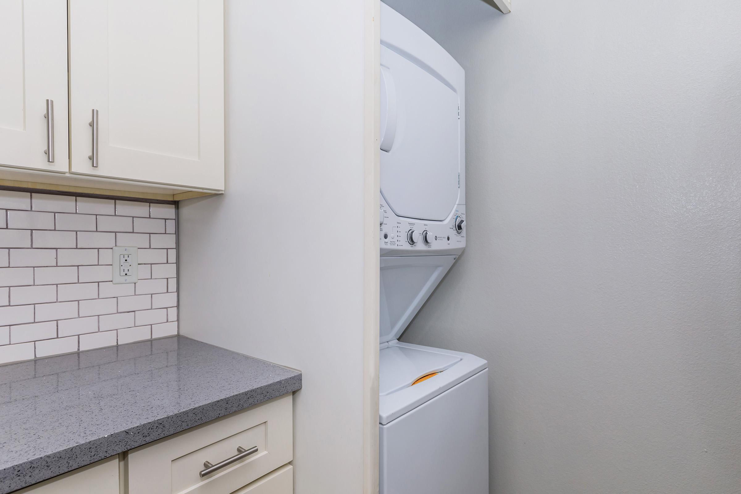 a kitchen with a sink and a refrigerator