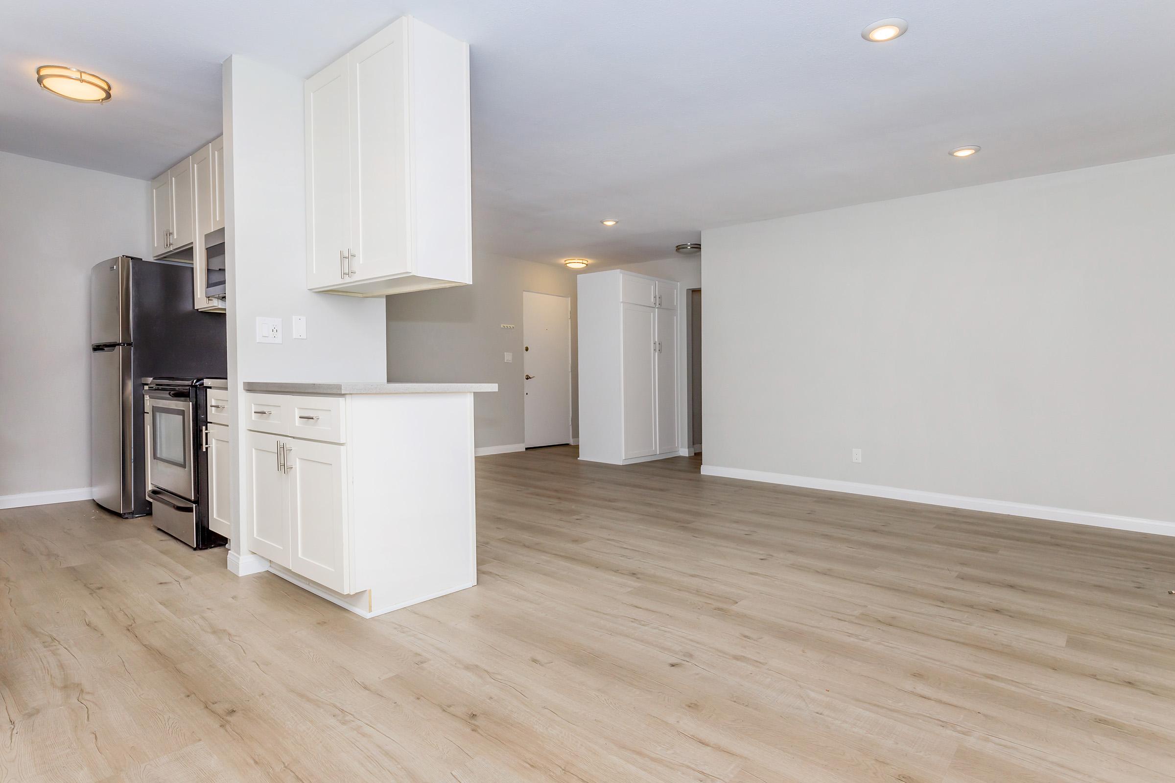 a kitchen with a wooden floor