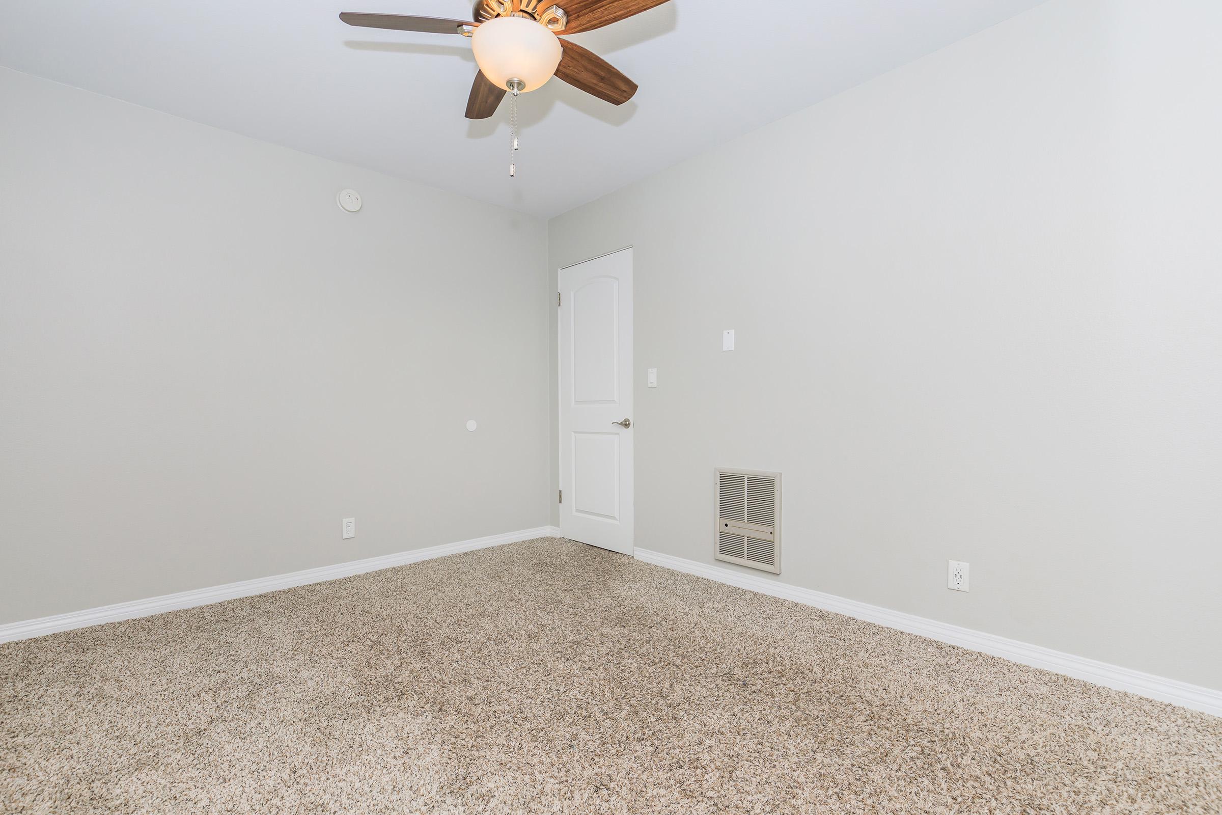 a bedroom with a large mirror