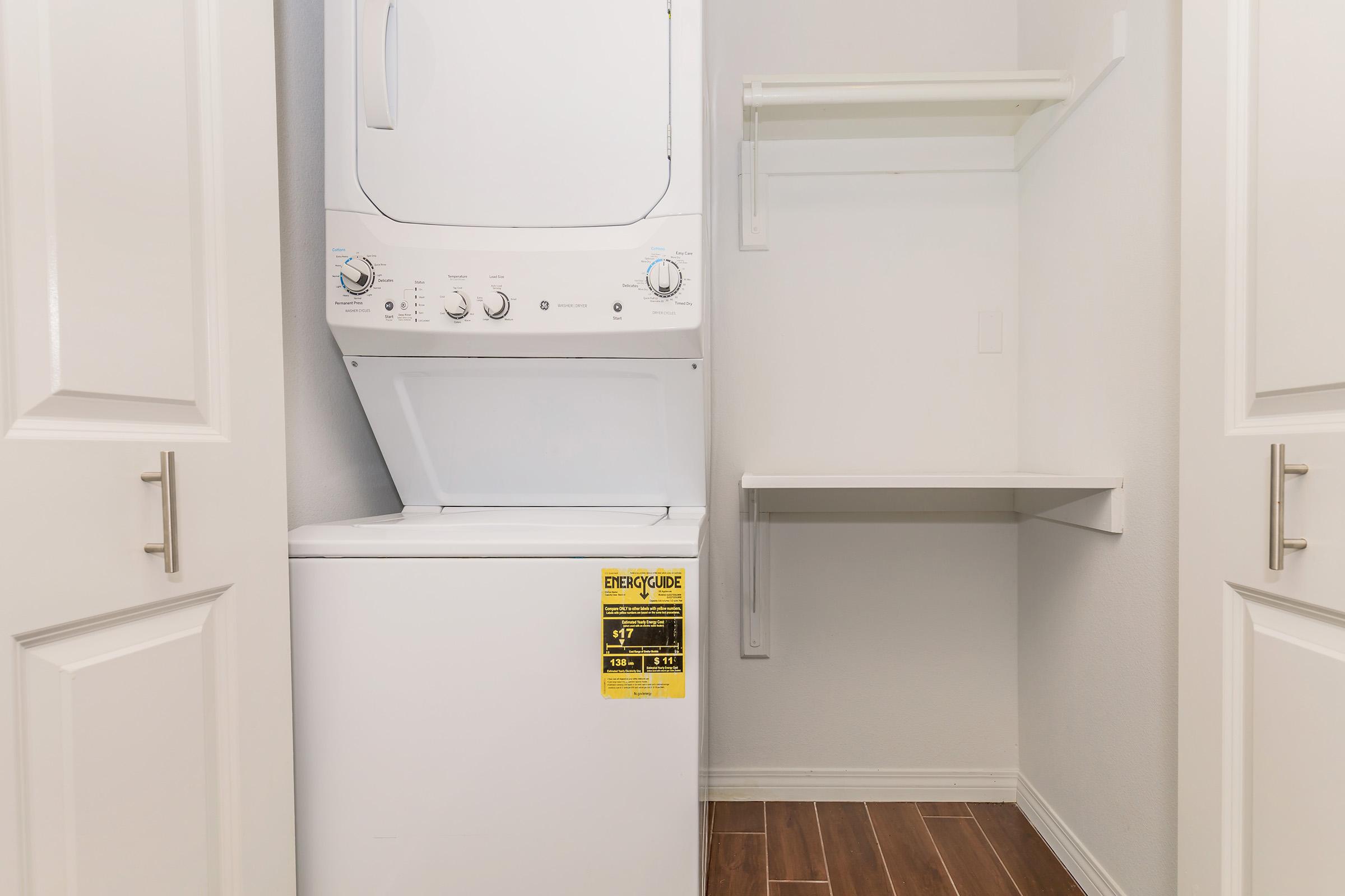 a microwave oven sitting on top of a refrigerator