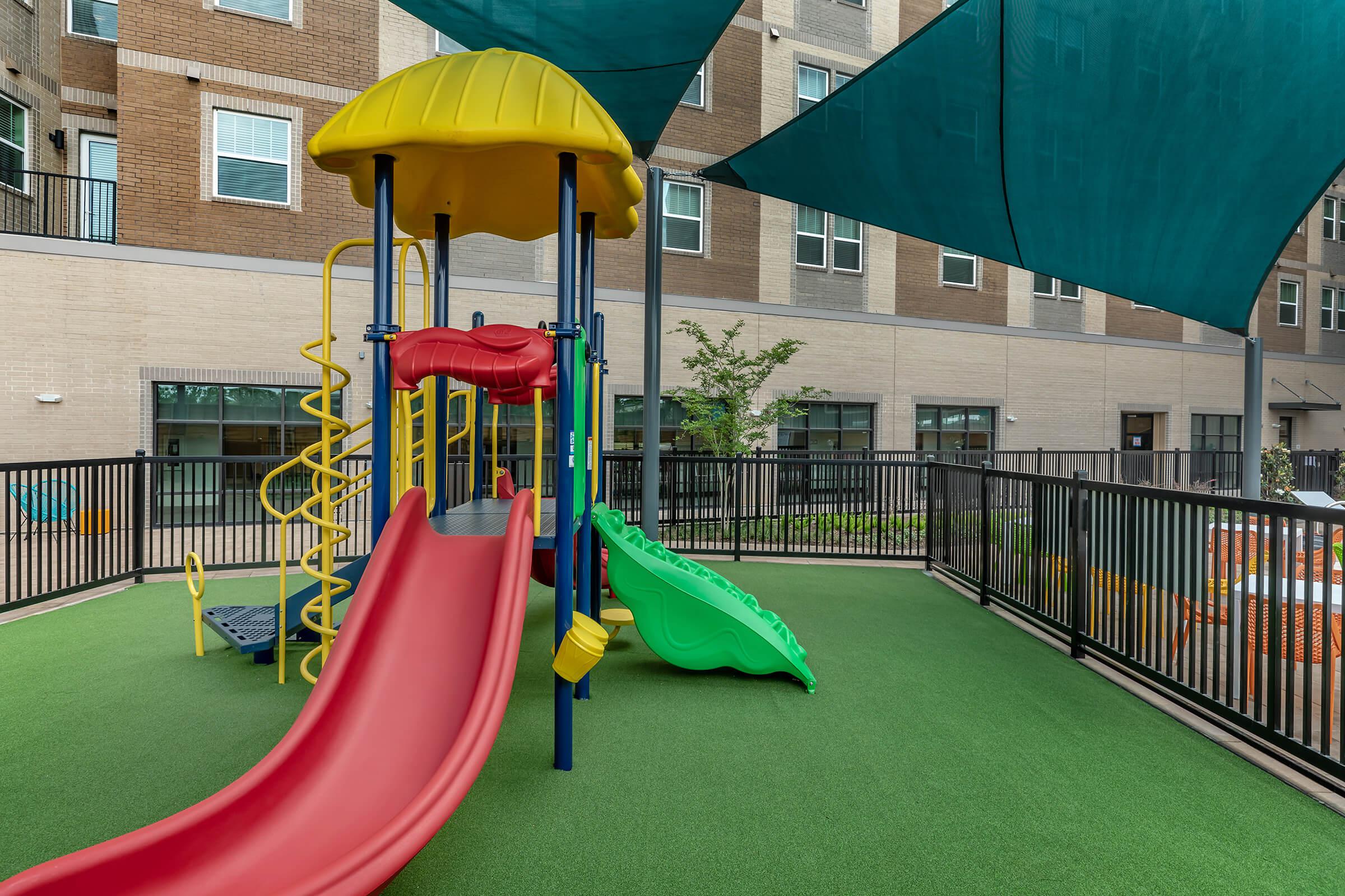 KIDS WILL LOVE THE FENCED PLAY AREA