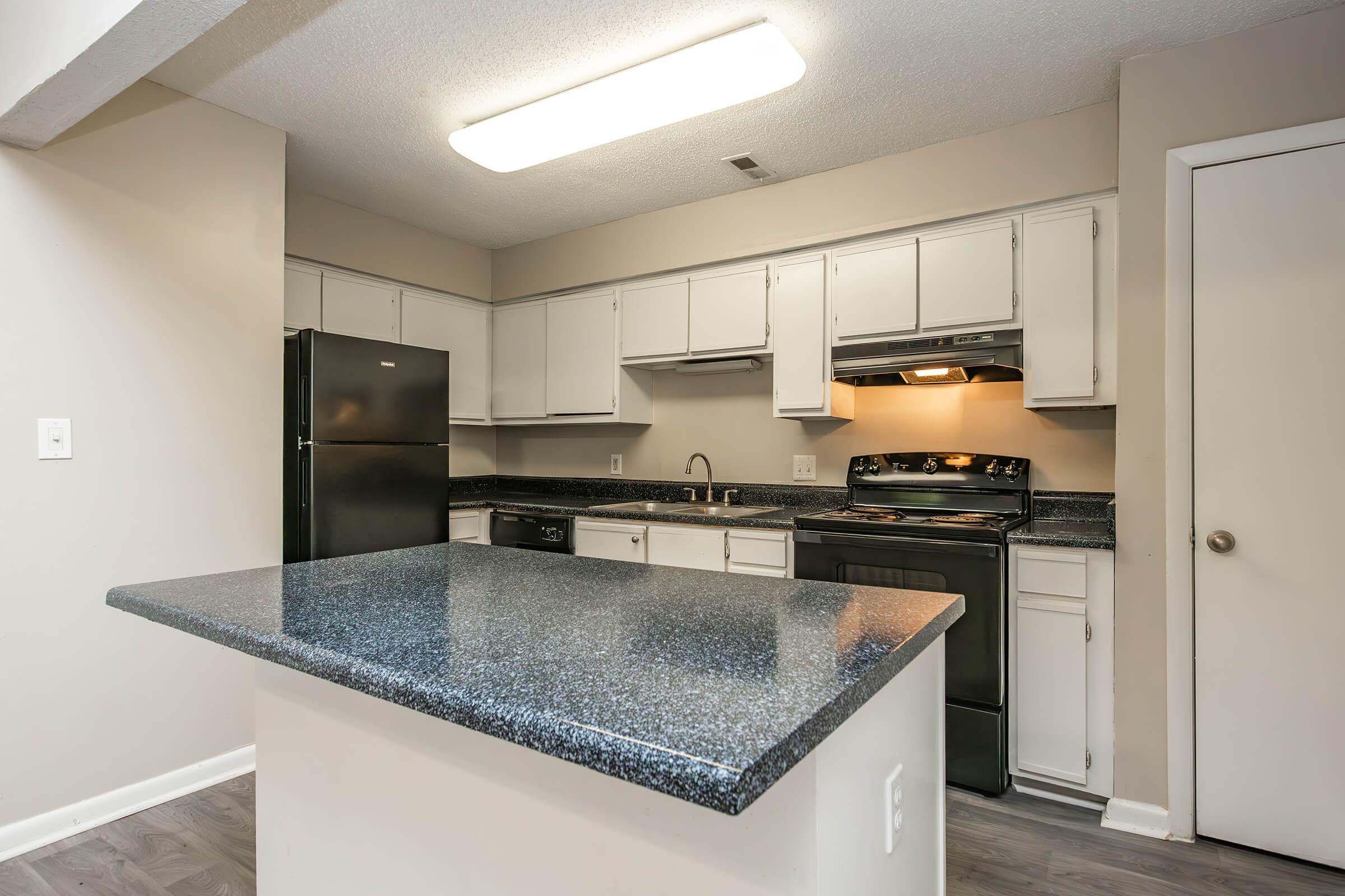 a modern kitchen with stainless steel appliances