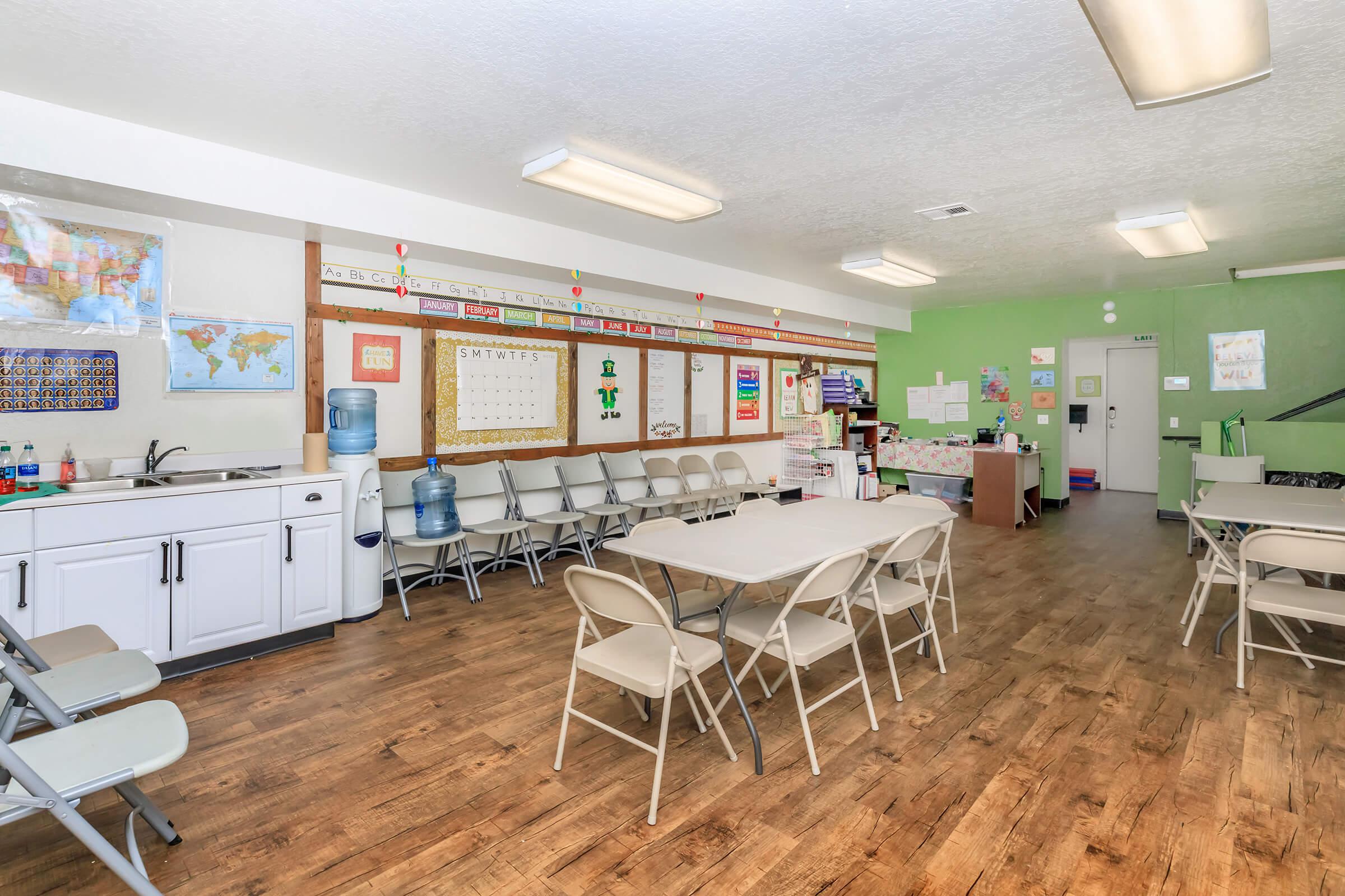 Community room with wooden floors