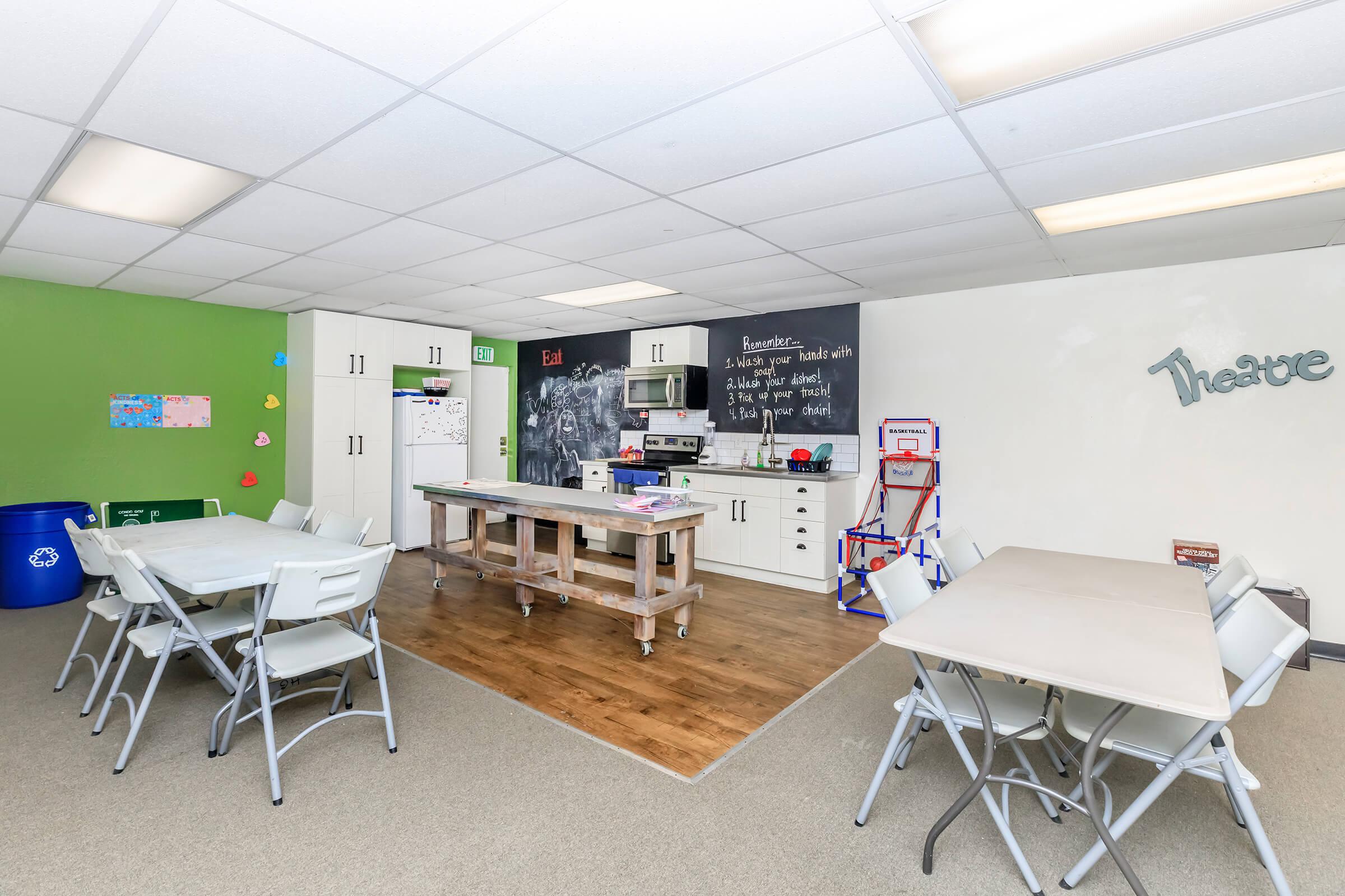 Harvest Glen community room with tables and chairs