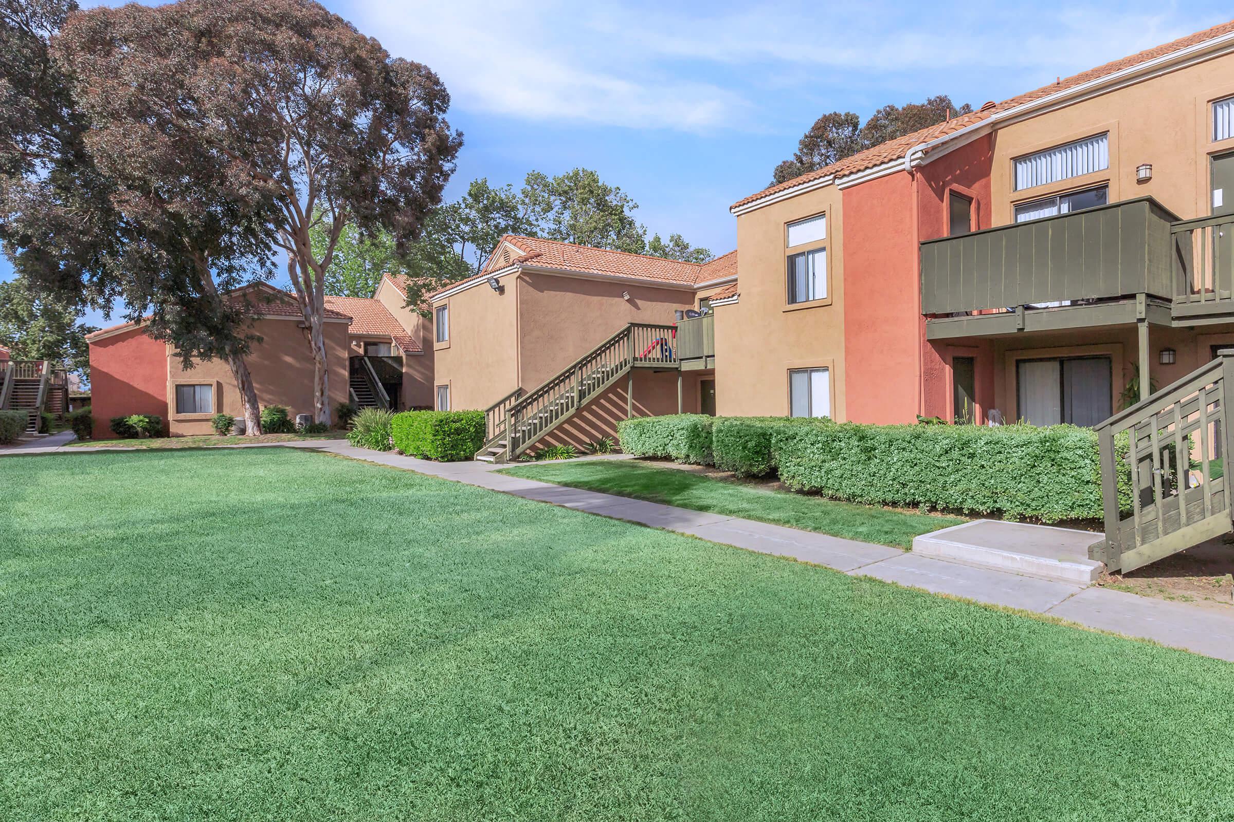 Harvest Glen community building with green grass