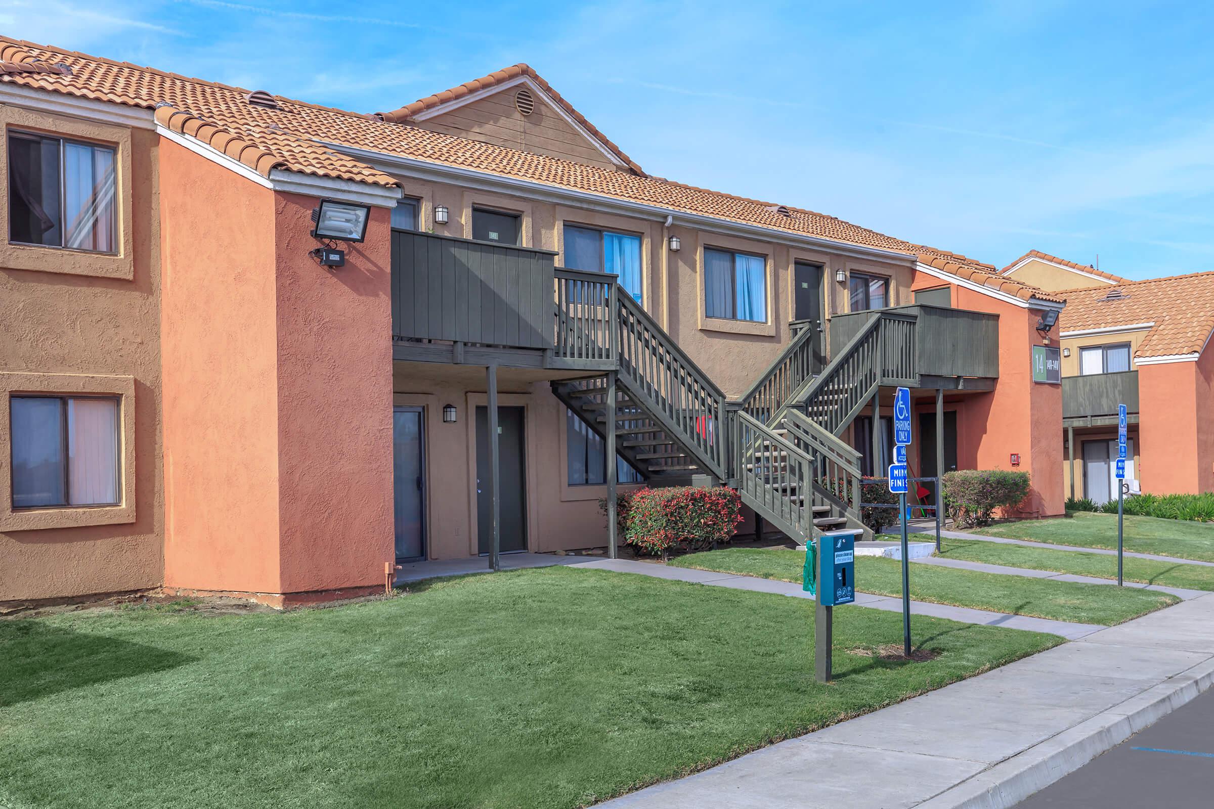 Community building with green grass and stairs