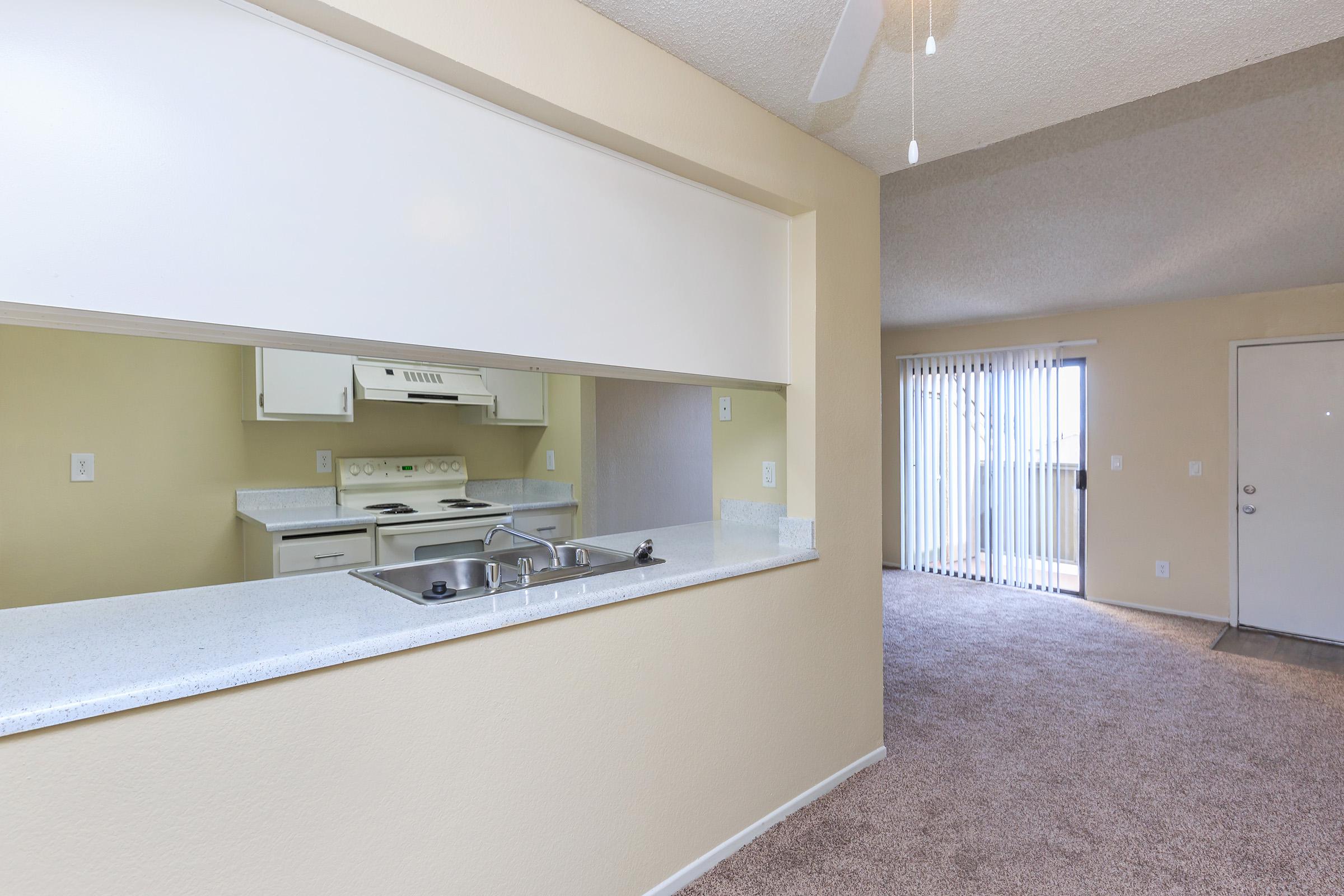 Vacant living room with sliding glass doors